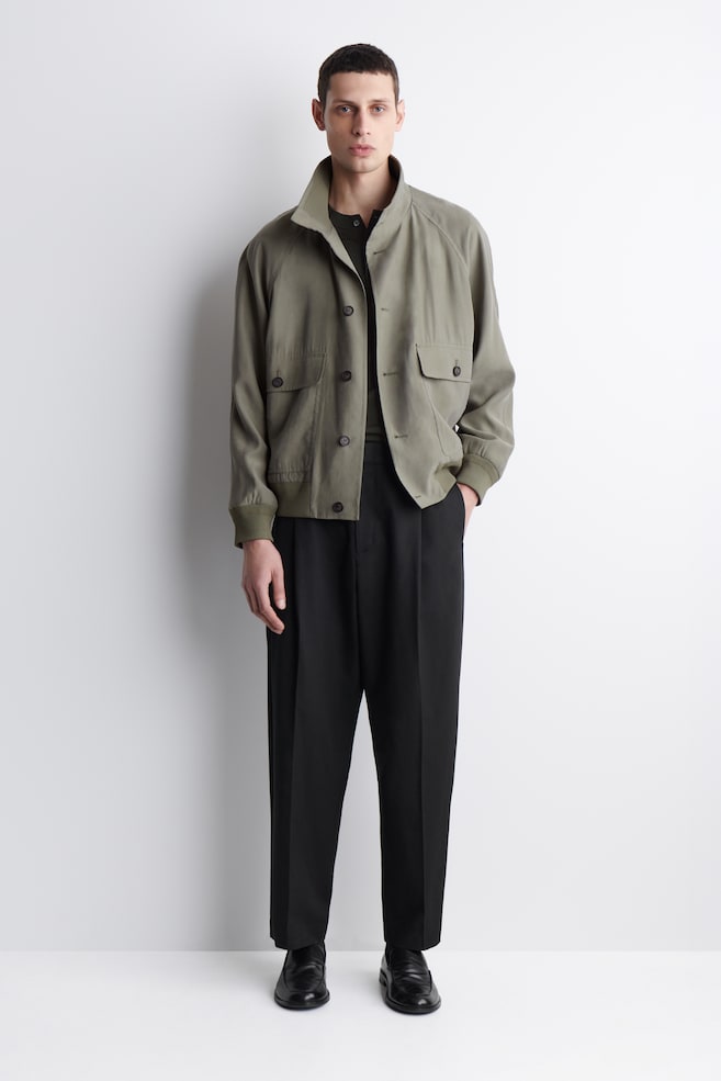 PLEATED RELAXED-FIT TAPERED TROUSERS - BLACK - 1