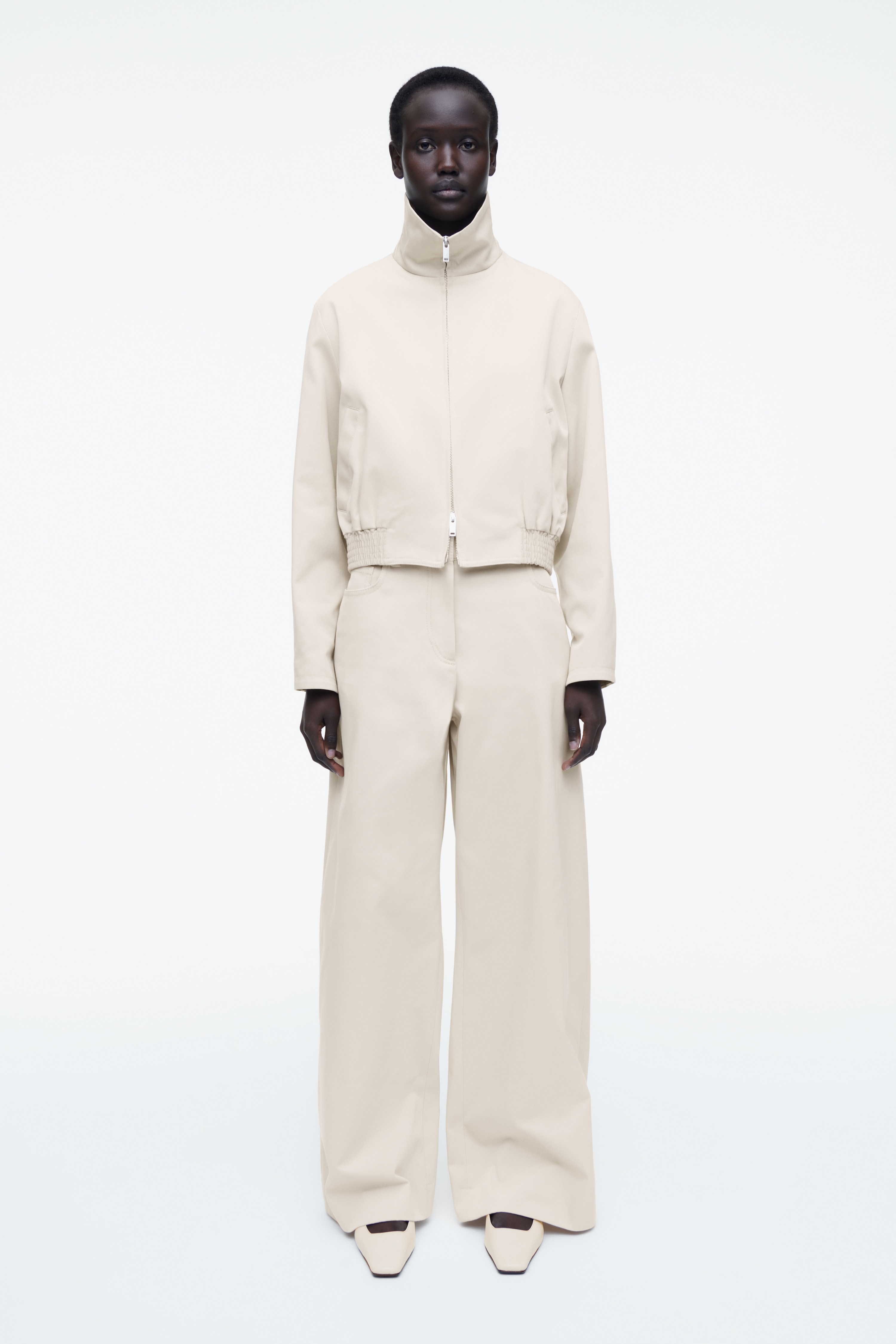 BAWEŁNIANE SPODNIE Z SZEROKIMI NOGAWKAMI - JASNOBEŻOWY