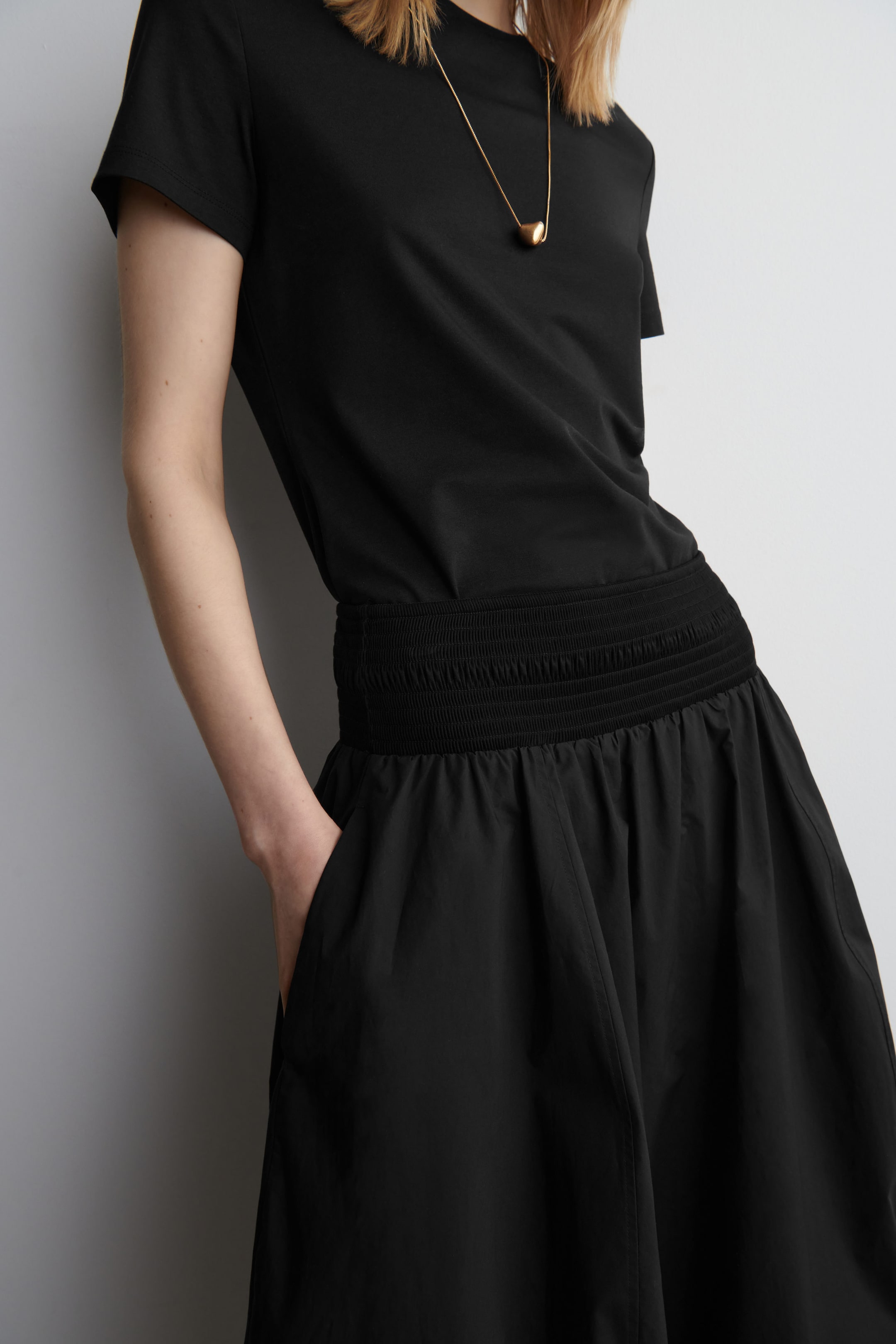 SMOCKED PANELED MIDI SKIRT