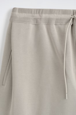 COTTON-PIQUÉ OVERSIZED BARREL-LEG JOGGERS — BEIGE 6