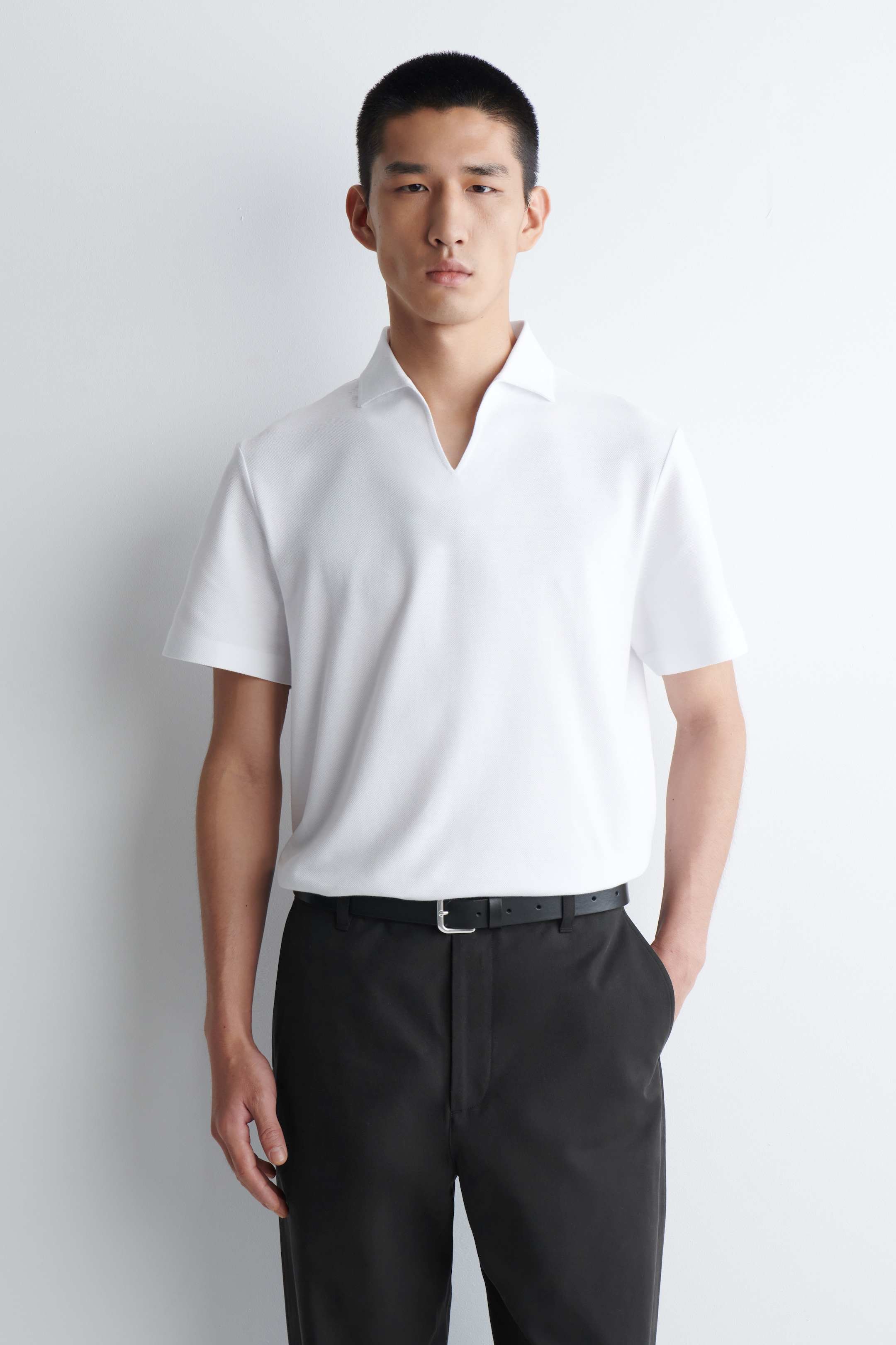Agrandir l'image: POLO EN PIQUÉ EN TISSU TECHNIQUE - BLANC - HOMME | H&M FR 1