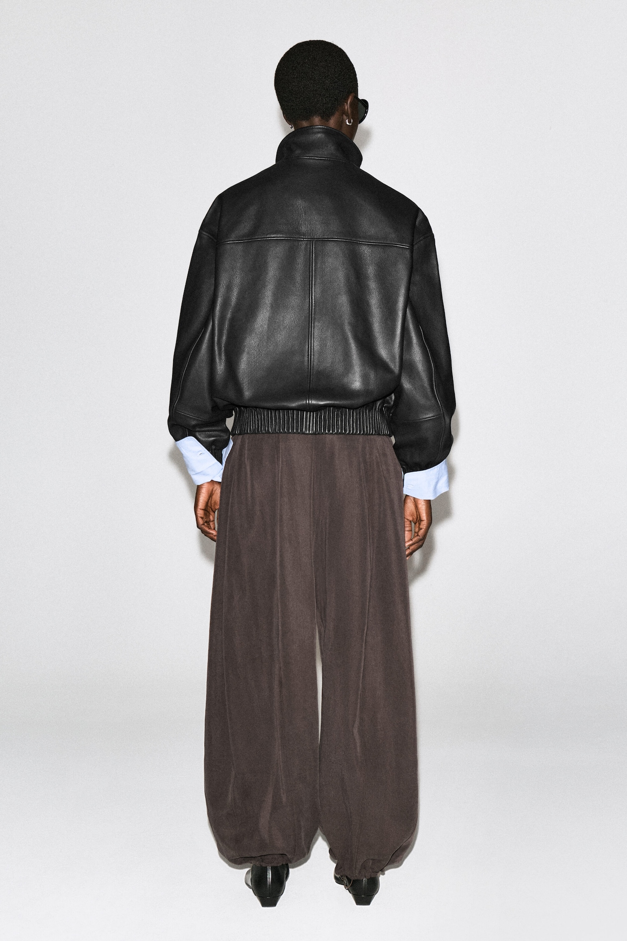 LEATHER MOCK-NECK BOMBER JACKET — BLACK