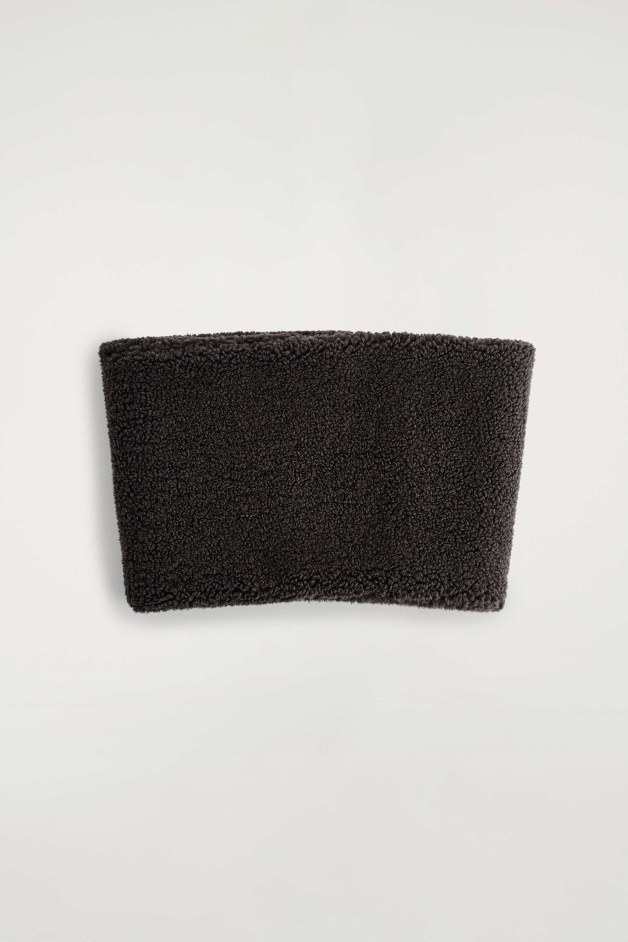 View larger image: A dark-chocolate teddy snood is presented flat, showcasing its continuous tubular form and plush, textured surface.
