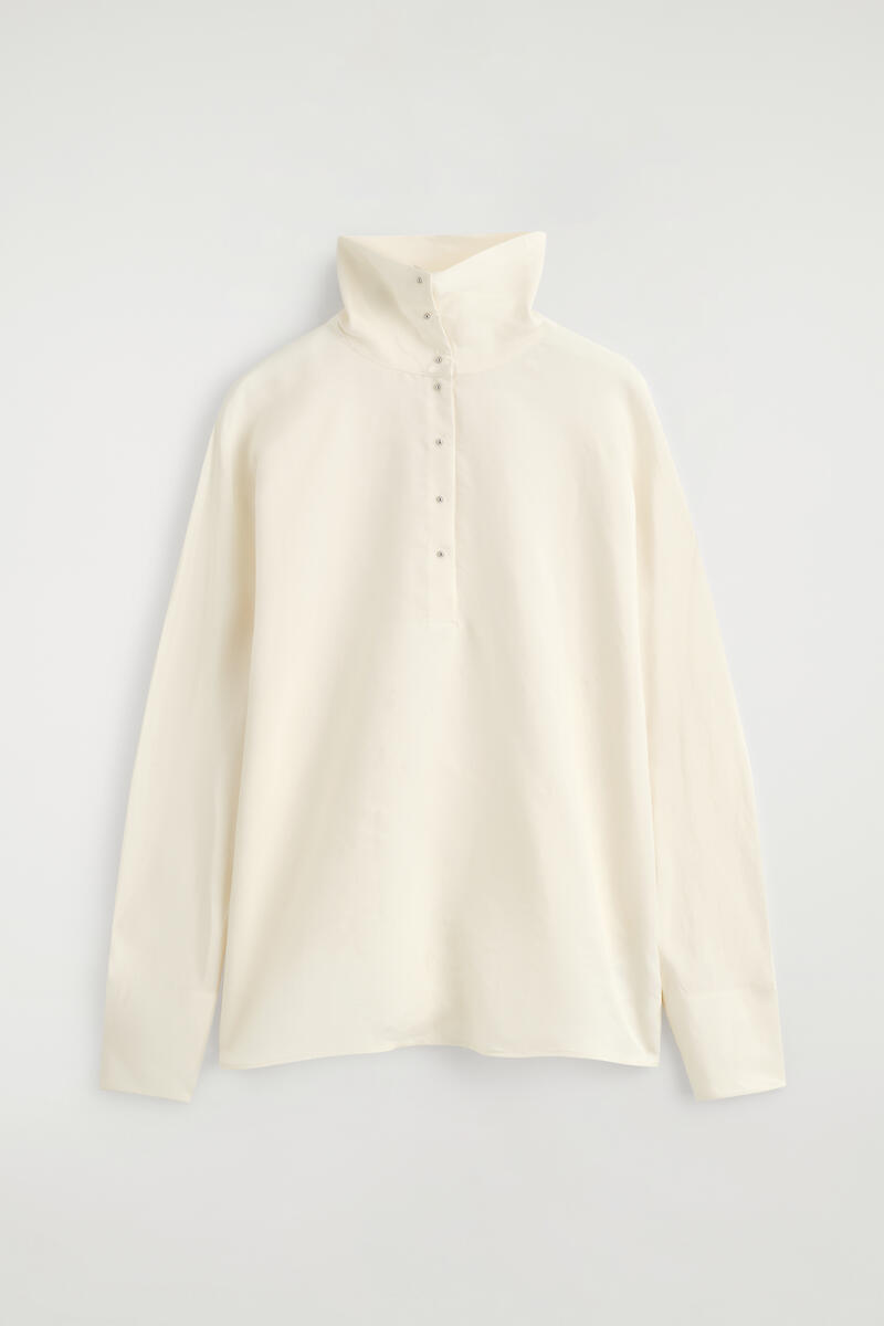 Stud-Detail Turtleneck Blouse in Beige