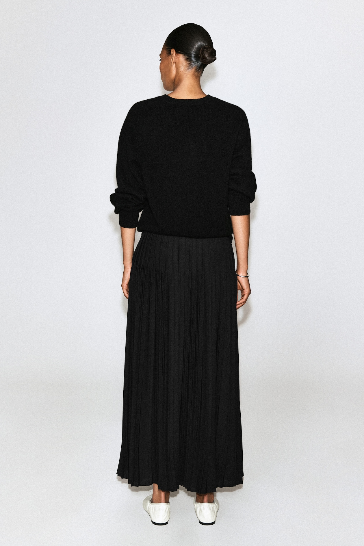 PLEATED CREPE MIDI SKIRT — BLACK