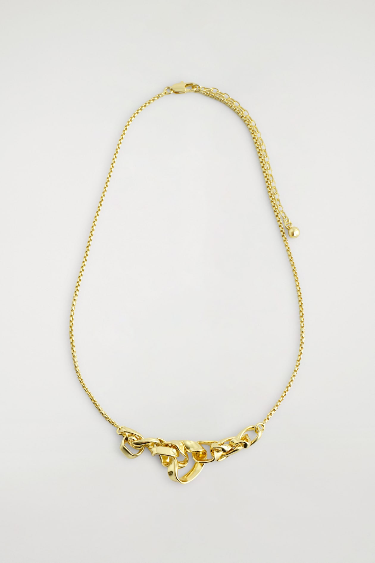 TWISTED RIBBON NECKLACE — GOLD