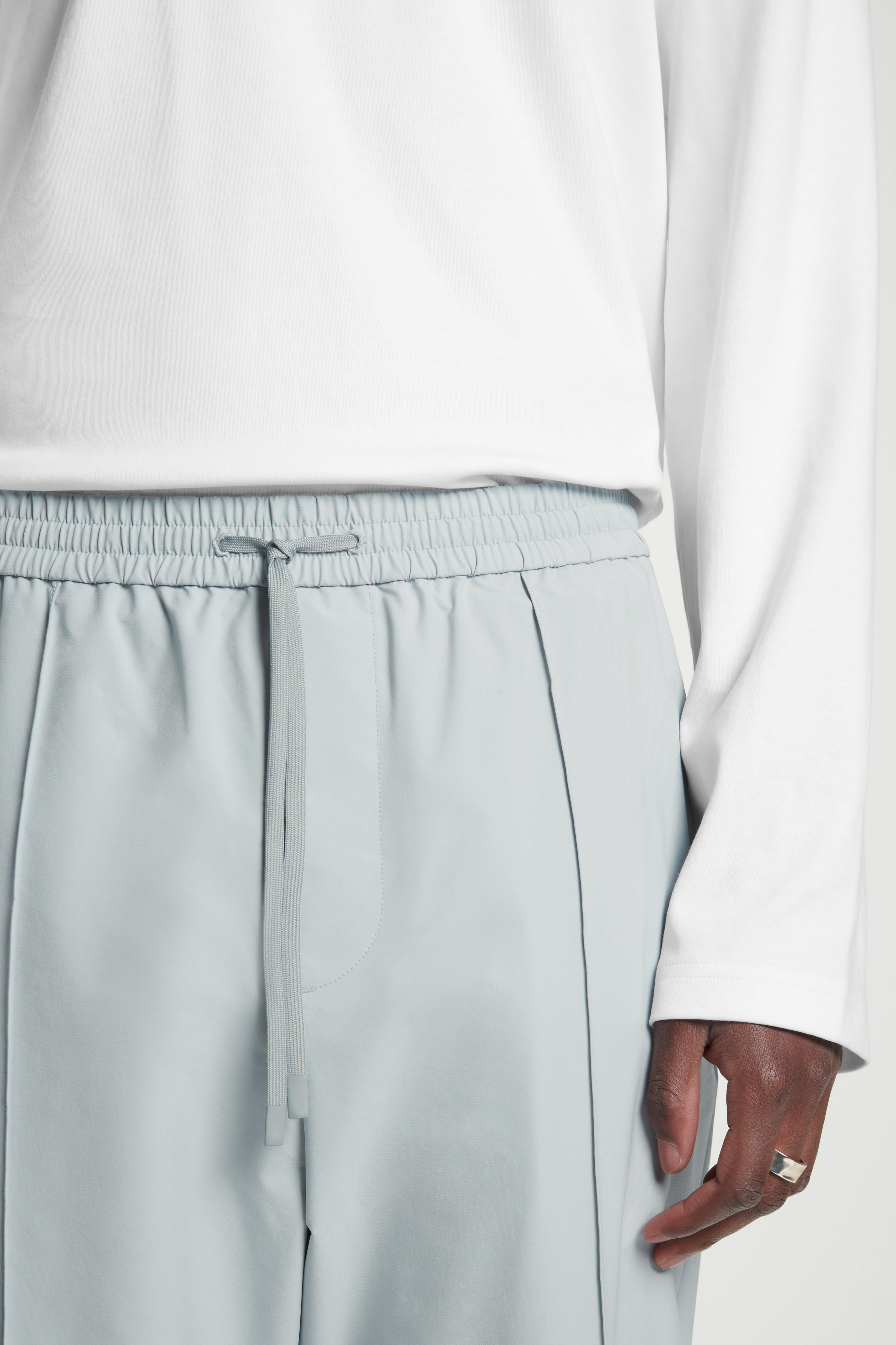 PINTUCKED TAPERED TRACK PANTS - GRAY | COS