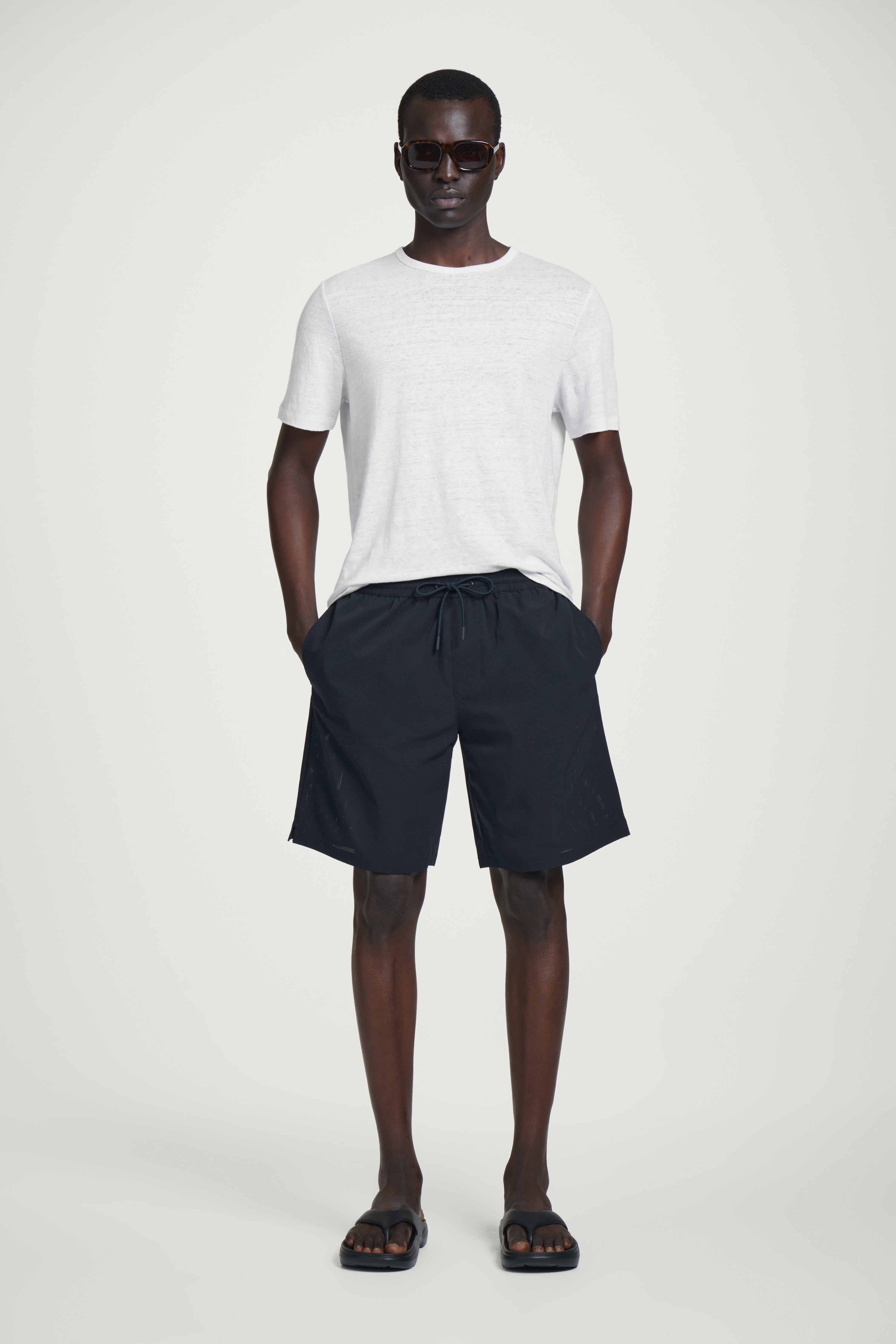PERFORATED SWIM BOARD SHORTS - NAVY