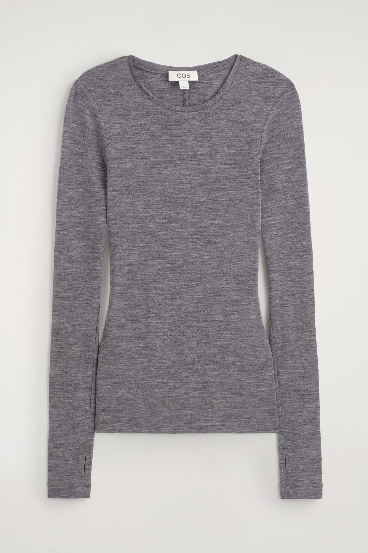 This slim merino wool top is shown from the front, featuring a fitted silhouette, a classic crew neck, and long sleeves in a melange grey knit. The sleeves extend downward and finish with integrated thumbhole details at the cuffs.