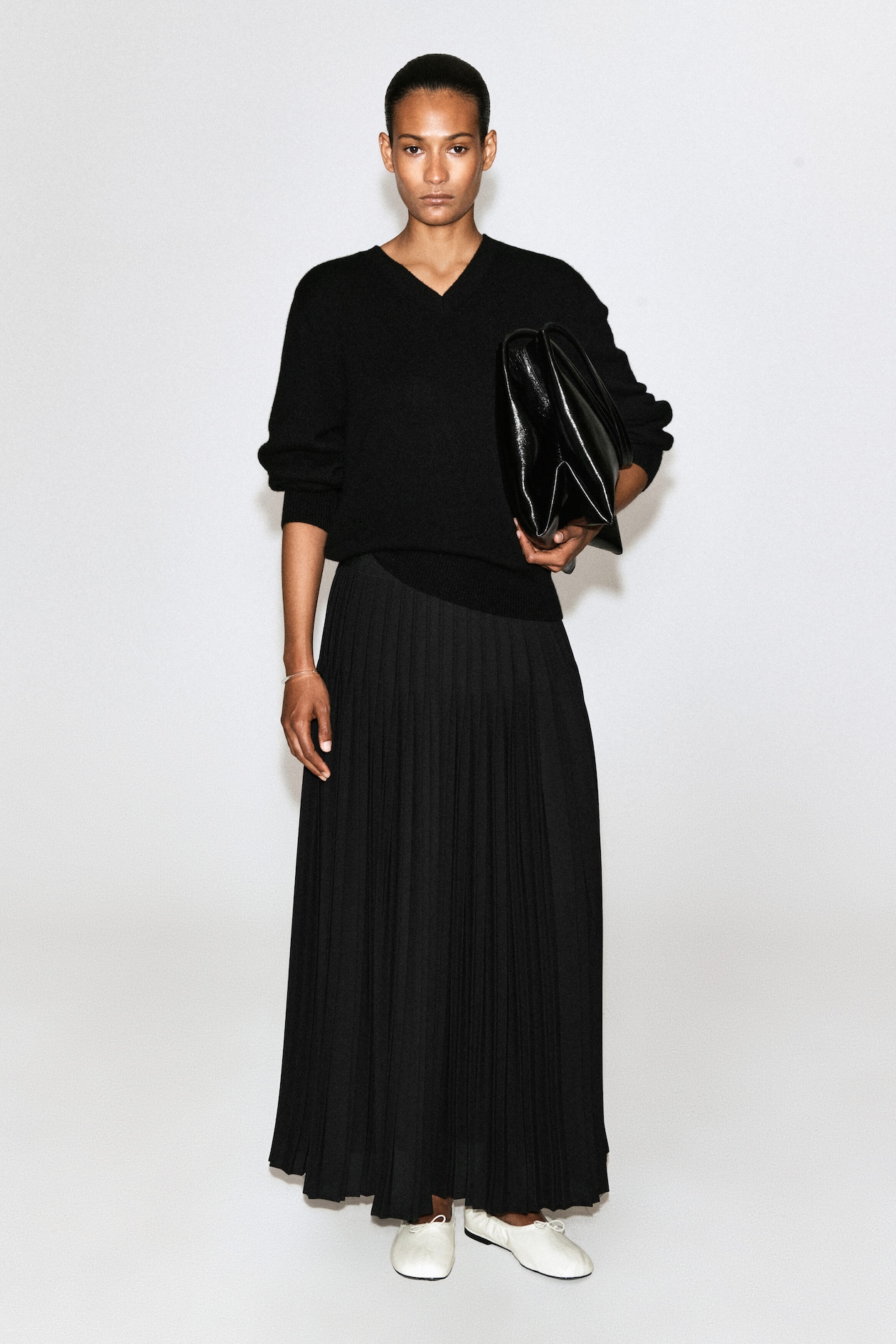 PLEATED CREPE MIDI SKIRT — BLACK