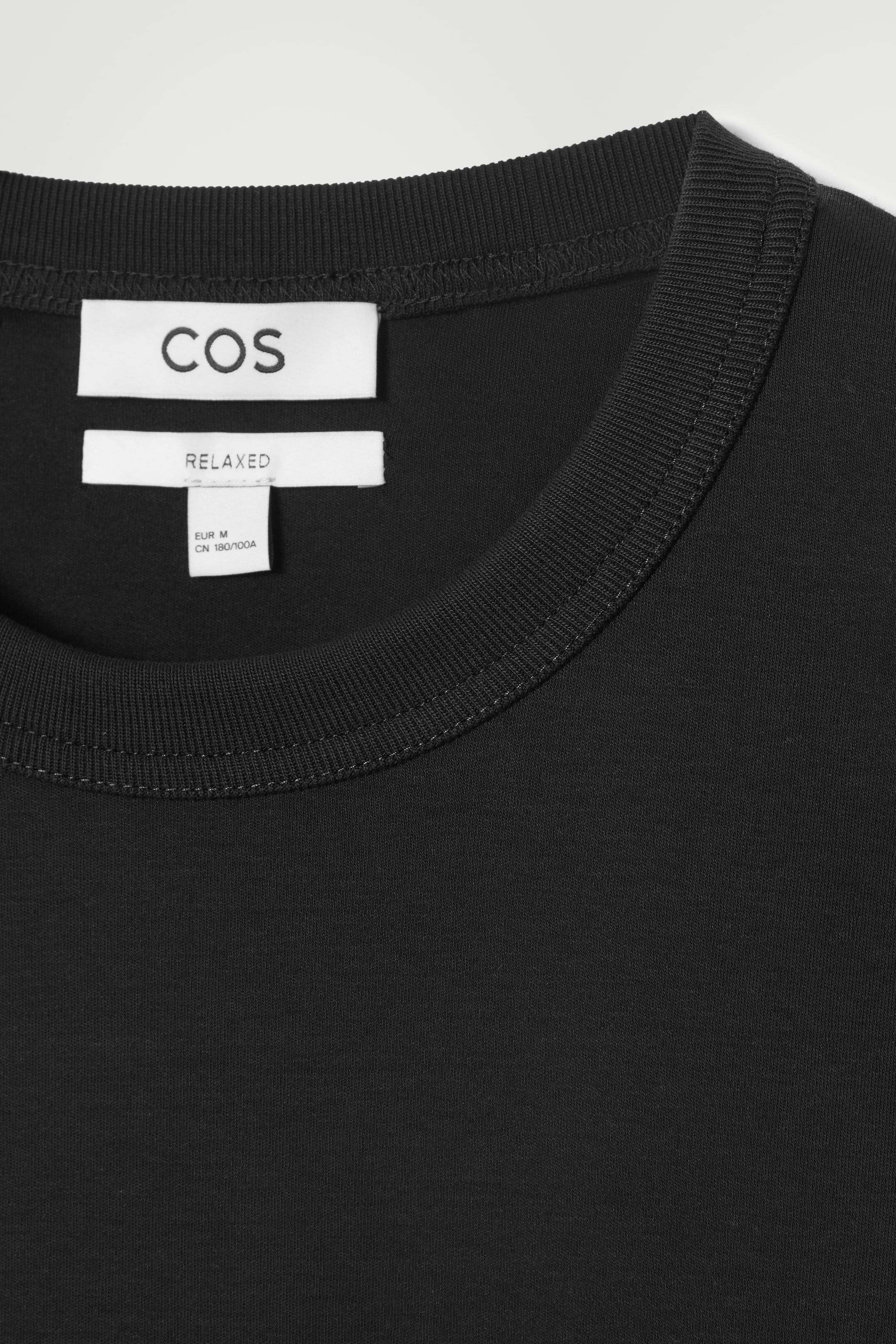 Grotere afbeelding bekijken: Relaxed jersey interlock T-shirt met lange mouwen - ZWART - HEREN | H&M BE 8