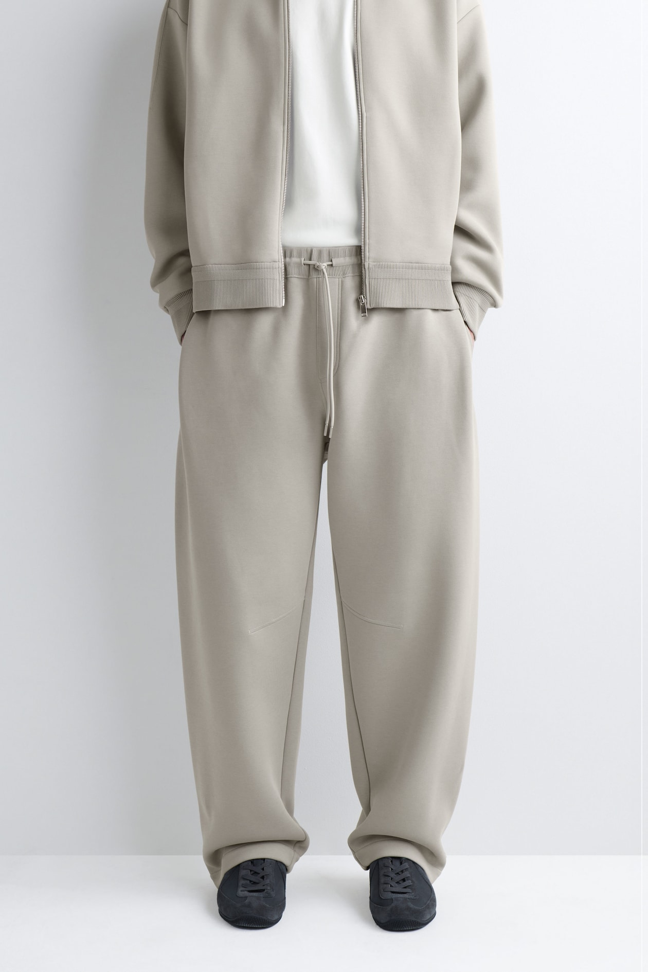 COTTON-PIQUÉ OVERSIZED BARREL-LEG JOGGERS — BEIGE