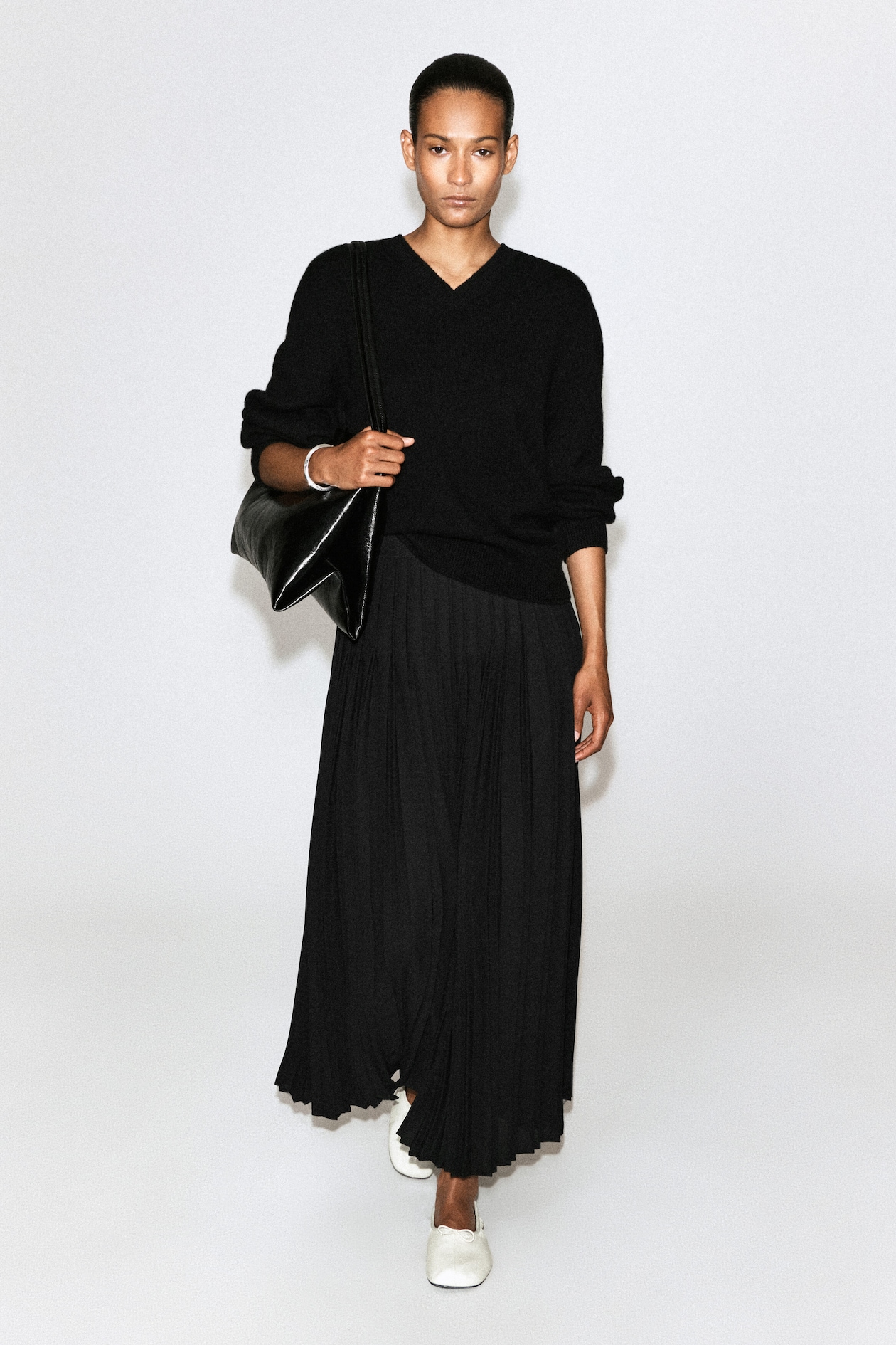 PLEATED CREPE MIDI SKIRT — BLACK
