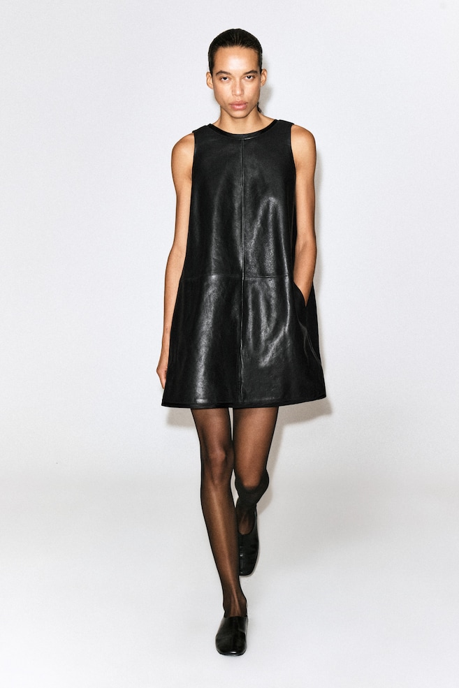 LEATHER A-LINE MINI DRESS — BLACK