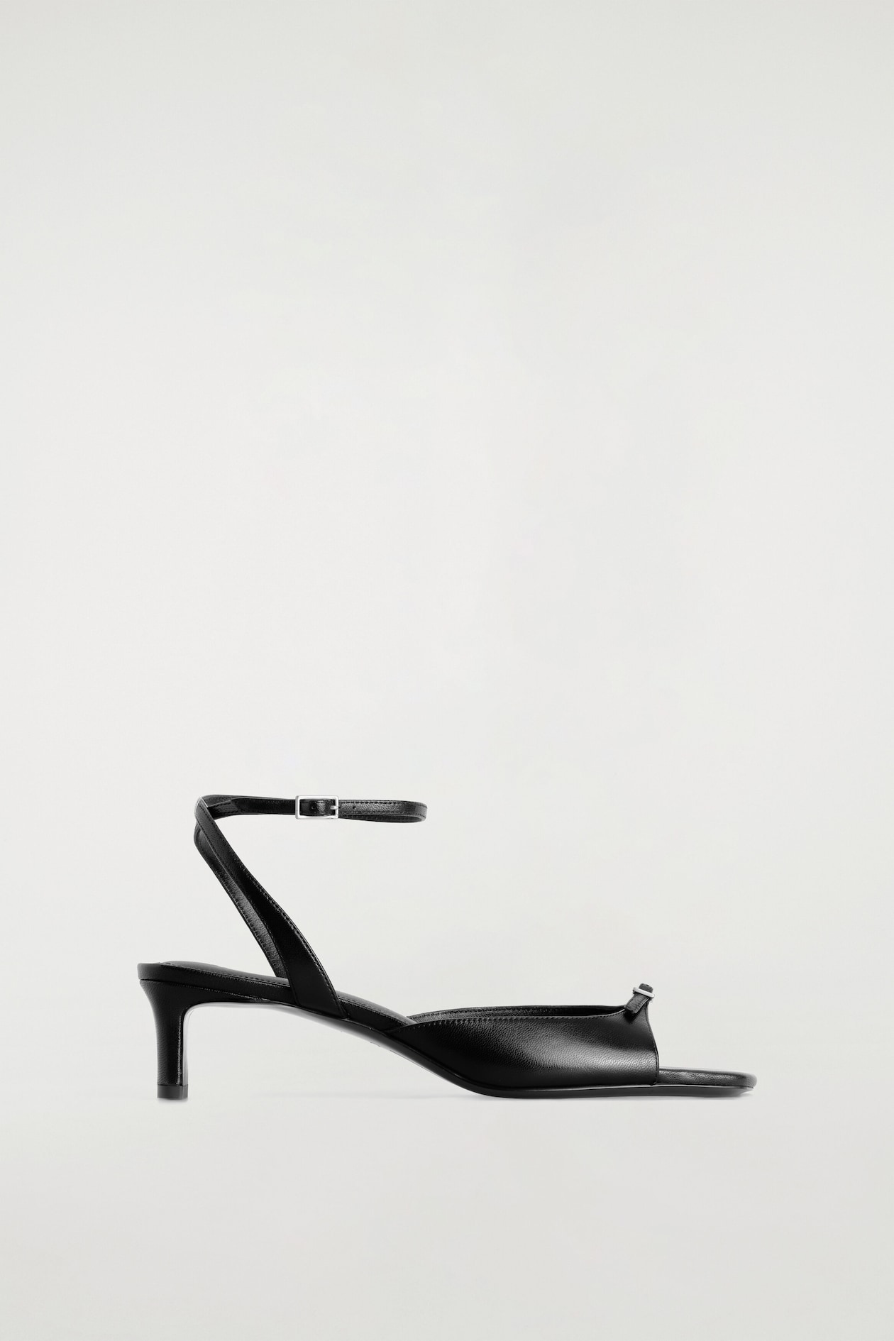 BUCKLED LEATHER KITTEN HEELS — BLACK