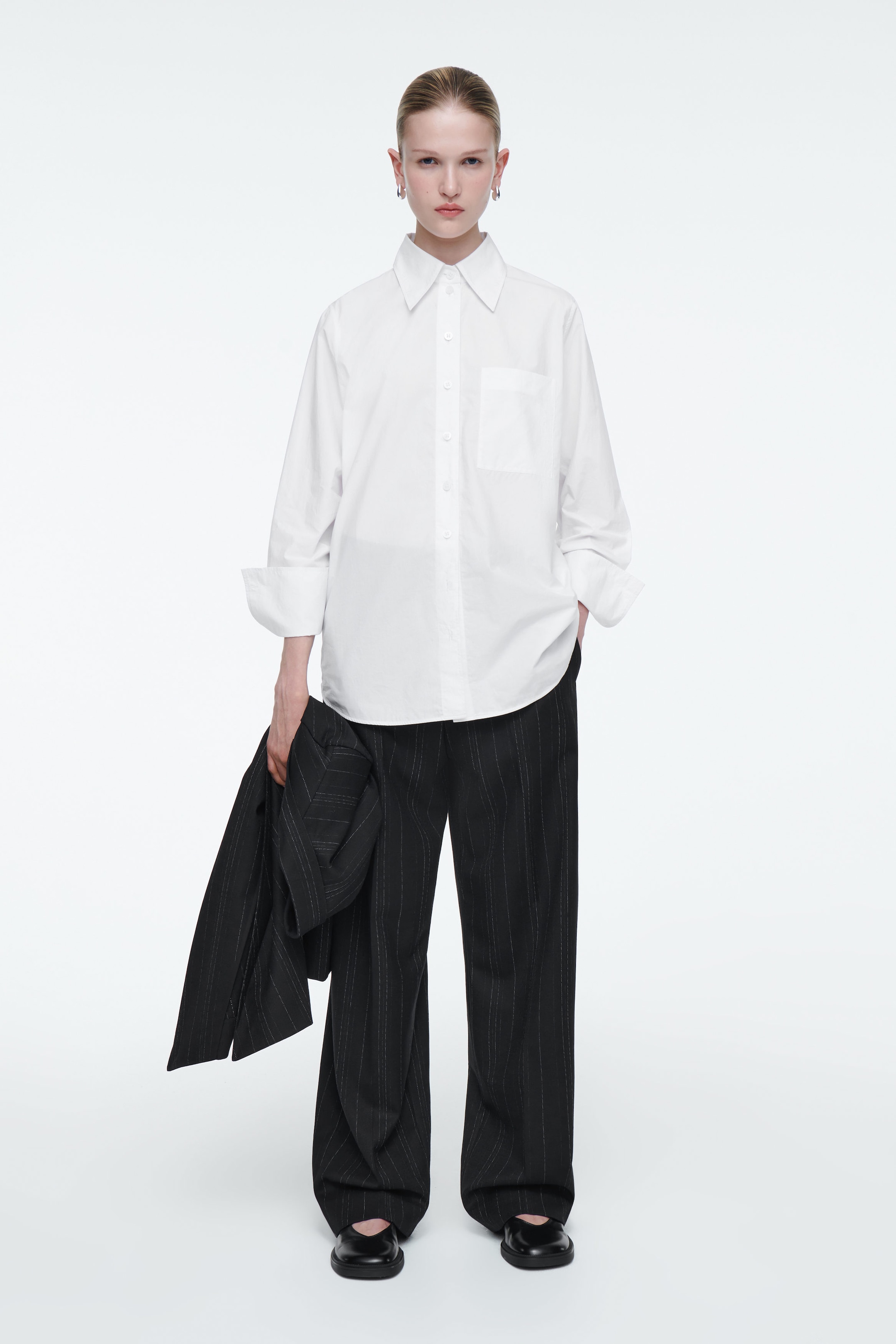 RELAXED PINSTRIPED BARREL-LEG TROUSERS