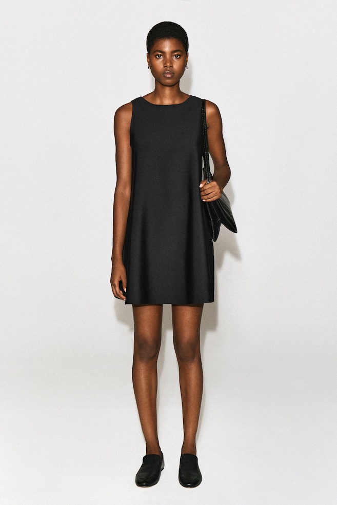 SCUBA A-LINE MINI DRESS — BLACK