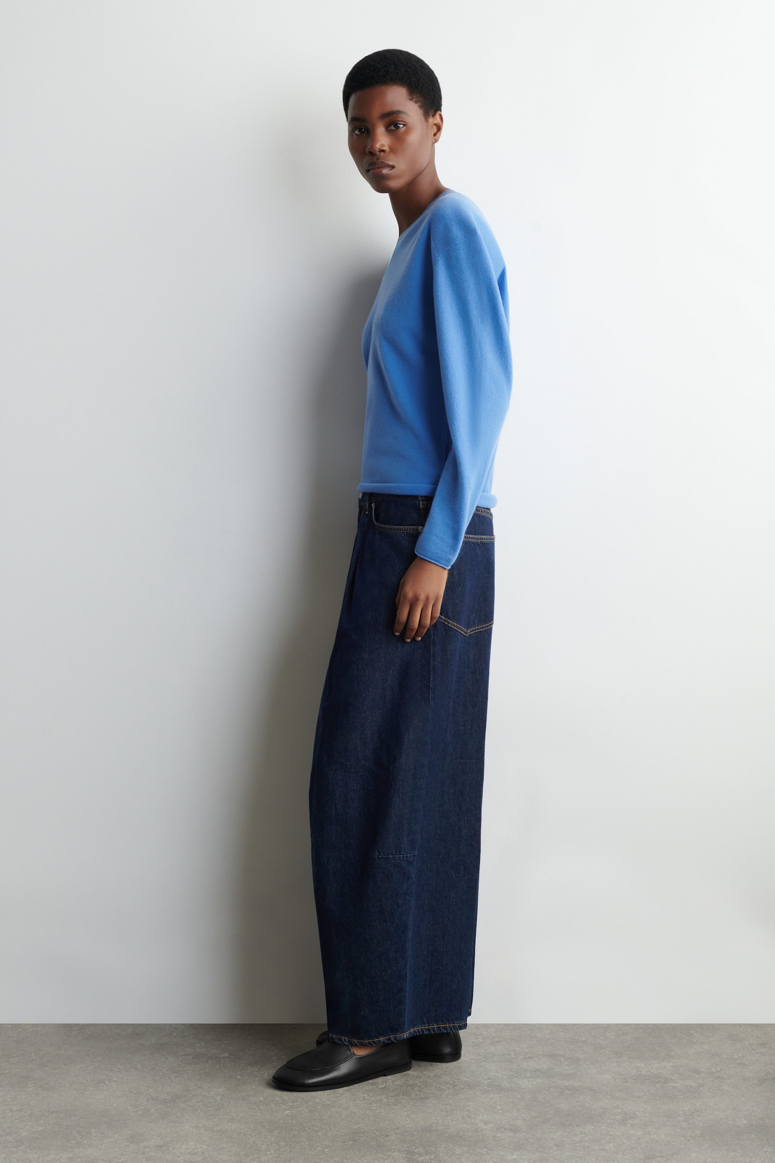 Indigo sweater with barrel jeans