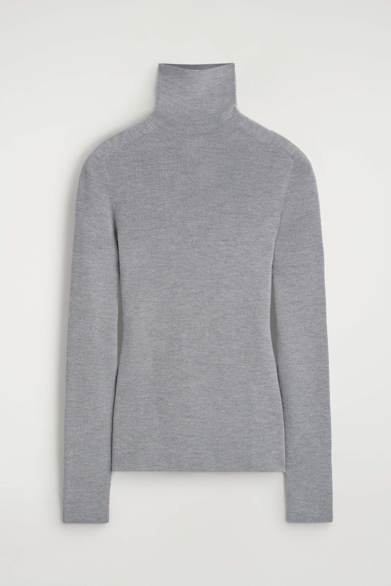 The sparkly seamless wool funnel-neck top is shown from the front, highlighting a fitted silhouette in a fine-knit gray fabric with a subtle shimmer. It features a tall ribbed funnel neck, long sleeves, and a clean seamless design.