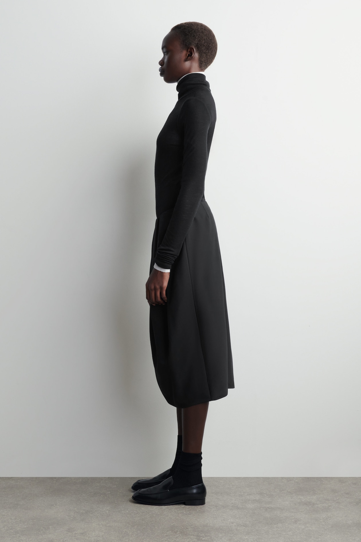 PLEATED WOOL MIDI TULIP SKIRT — BLACK