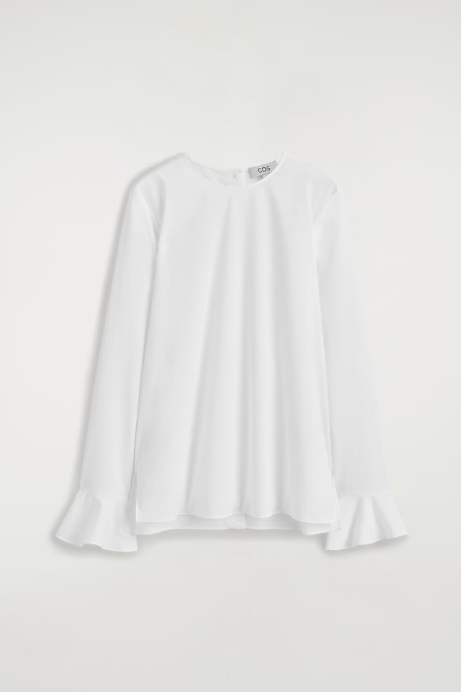BAUMWOLLBLUSE MIT AUSGESTELLTEN ÄRMELABSCHLÜSSEN - WEISS - 1
