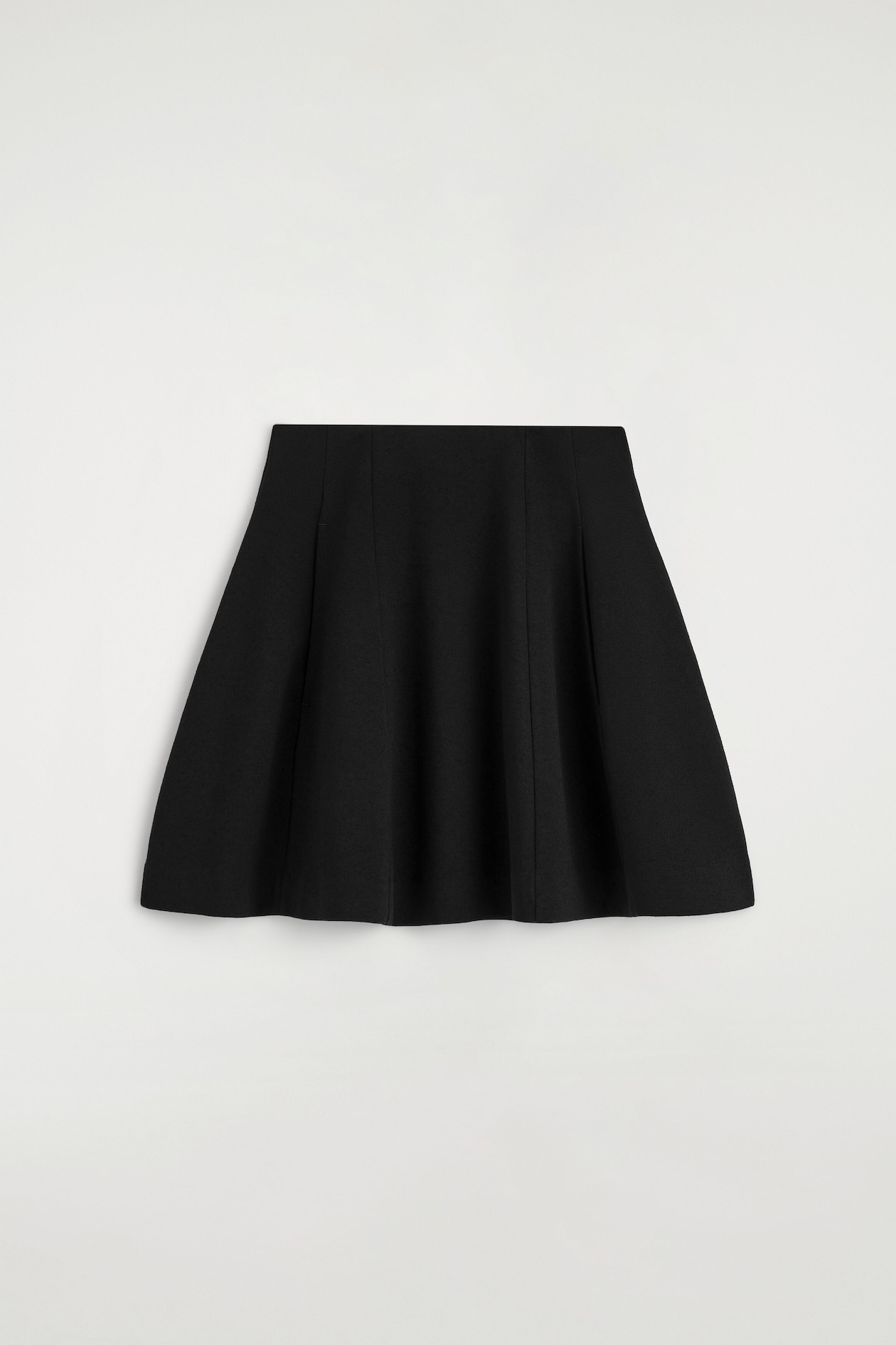 SCULPTED PANELED JERSEY MINI SKIRT — BLACK