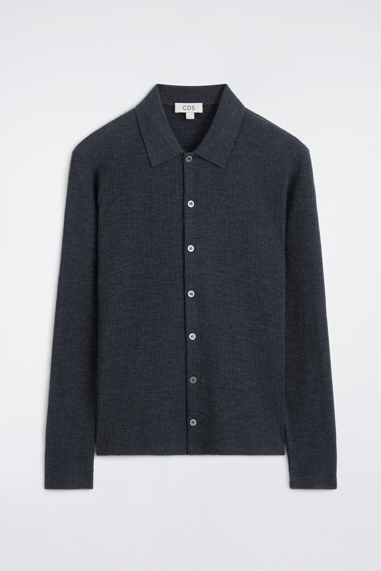 A dark grey, ribbed-knit long-sleeve shirt is shown from the front, featuring a spread collar and a full-length button placket. The garment showcases a fine vertical ribbed texture throughout, clean-finished cuffs, and a straight hem.