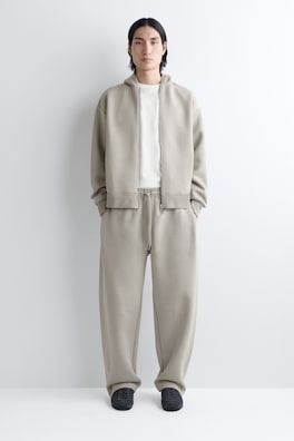 COTTON-PIQUÉ OVERSIZED BARREL-LEG JOGGERS — BEIGE 1