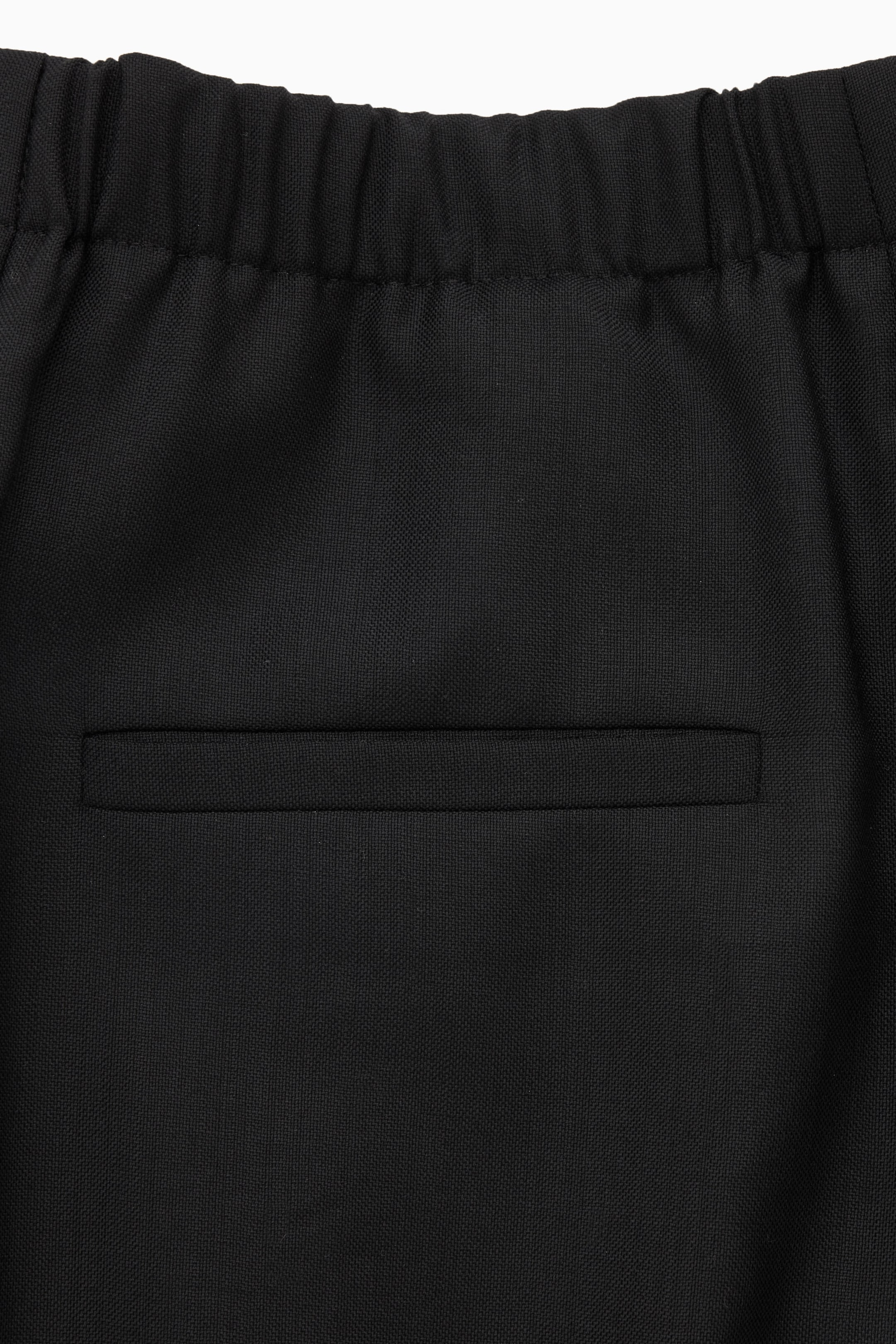 PLEATED WIDE-LEG WOOL PANTS
