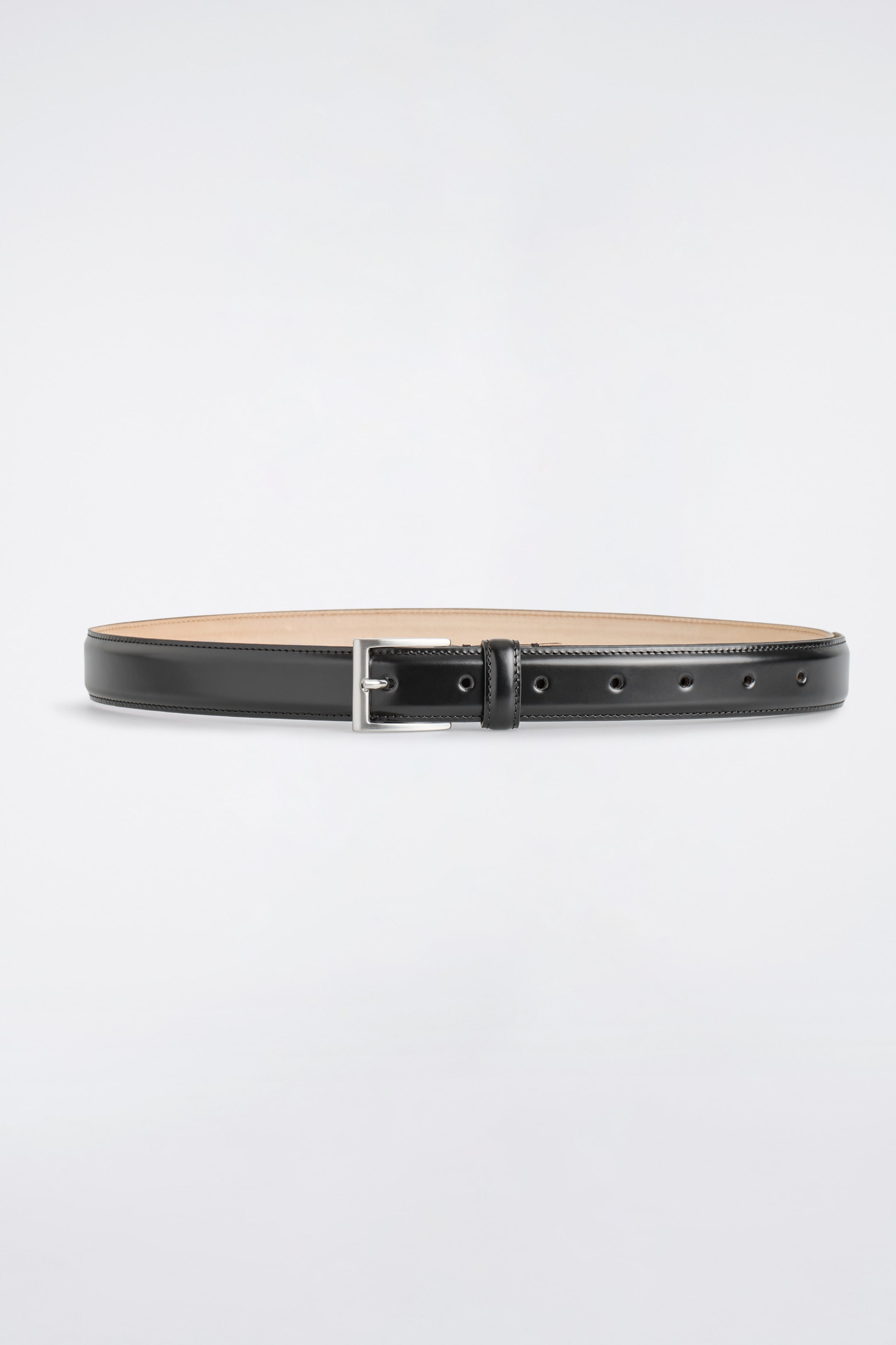 View larger image: A black leather belt is presenting FRONT, featuring a rectangular brushed silver-tone buckle. The belt is displaying multiple adjustment holes and a matching leather keeper loop, with visible edge stitching.