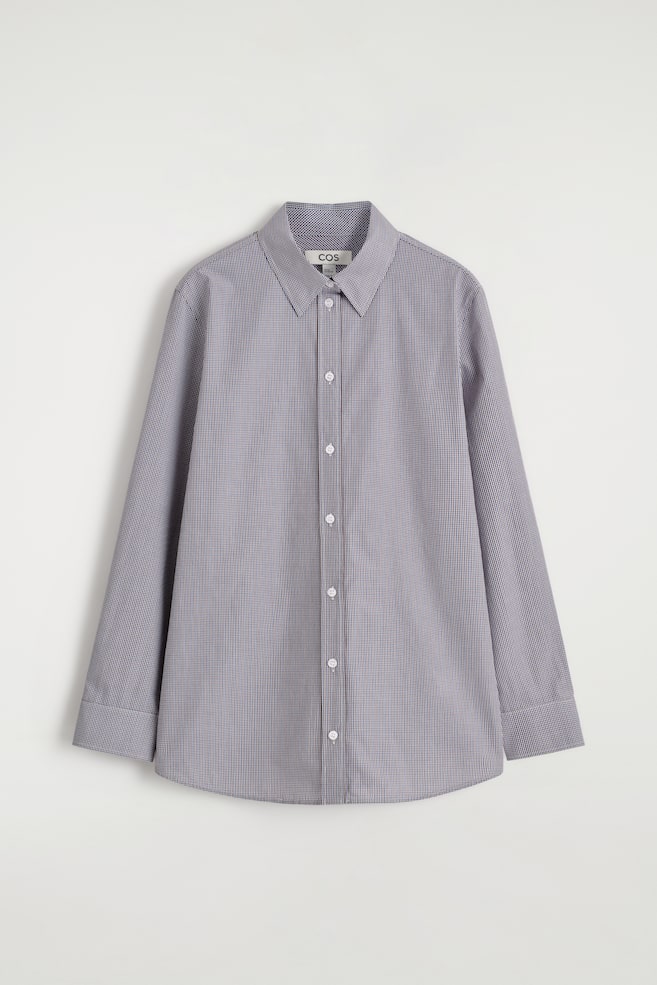 A grey shirt is being displayed in a FRONT view, featuring a small gingham check pattern. It is designed with a pointed collar, long sleeves, buttoned cuffs, and a full button placket down the front. - 1