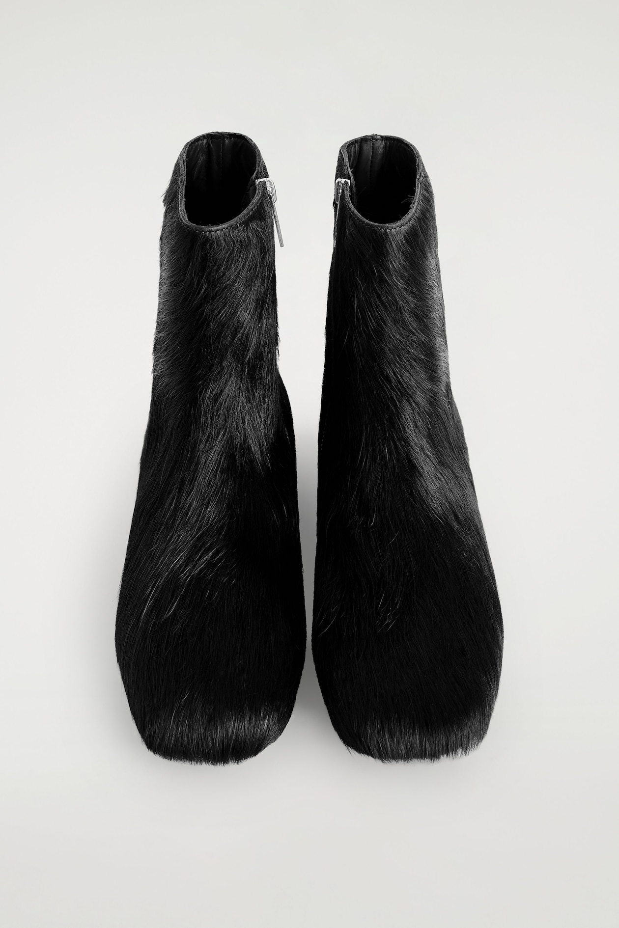 PONY HAIR-EFFECT LEATHER SOCK BOOTS — CARBON