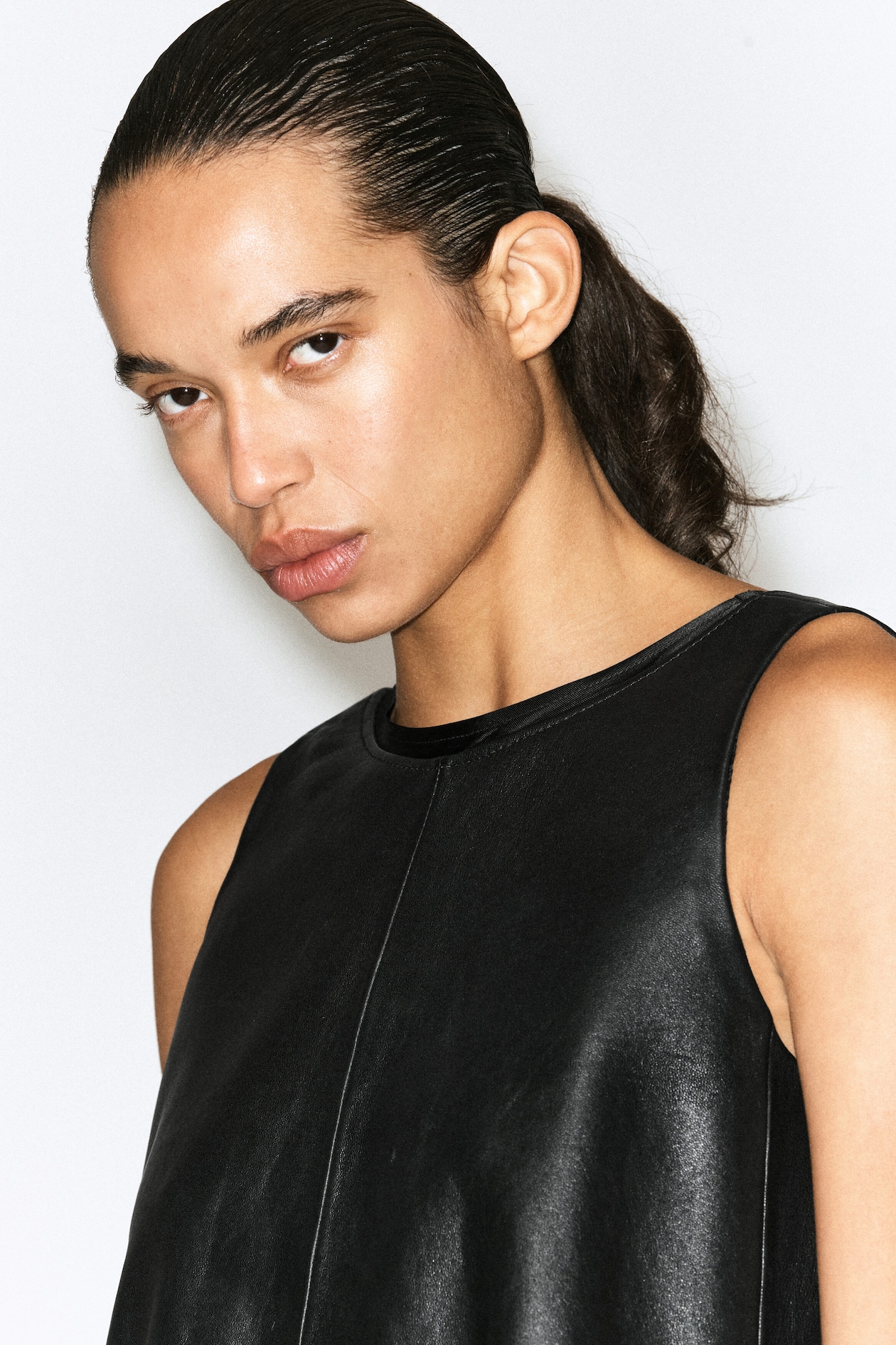 LEATHER A-LINE MINI DRESS — BLACK