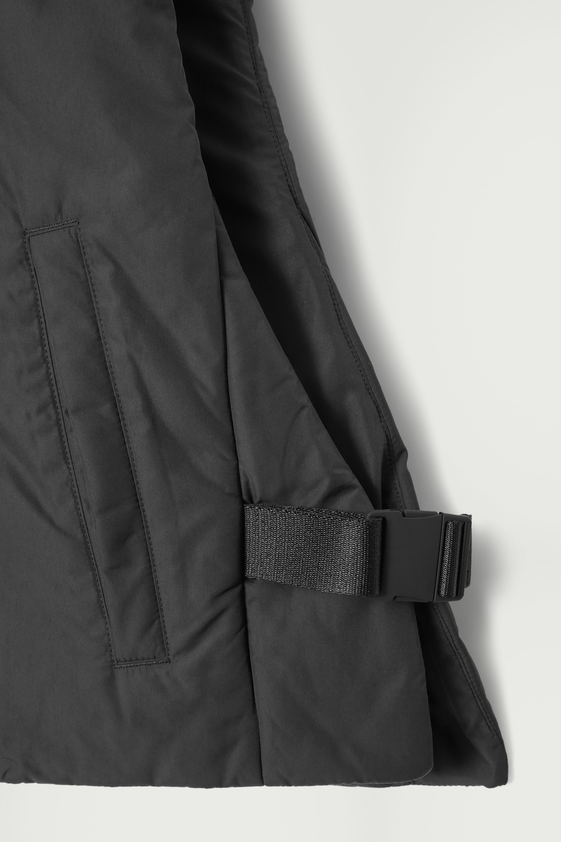 BUCKLED-SIDE PADDED HOODED VEST - BLACK | COS