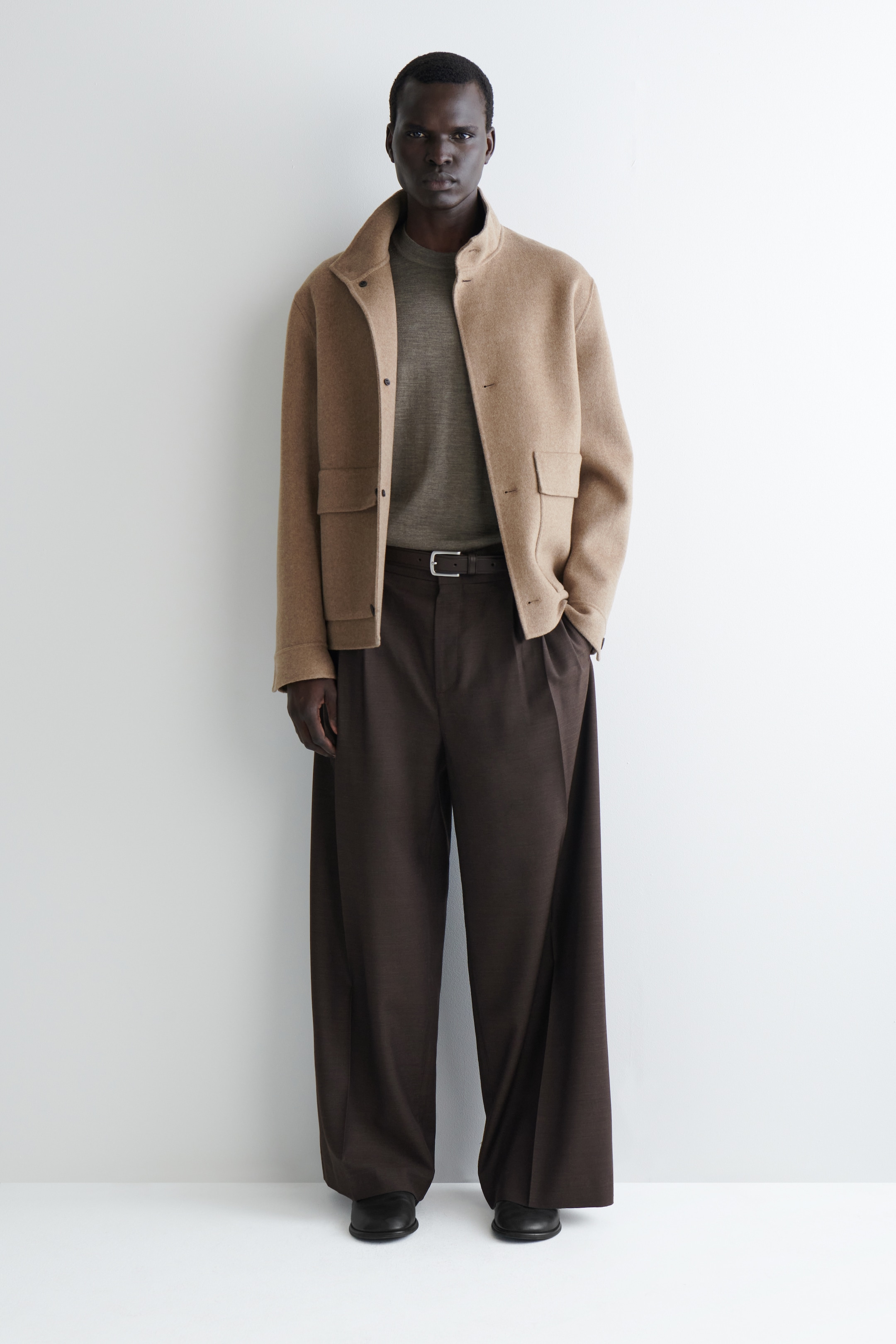 Grotere afbeelding bekijken: SLIM MERINO WOLLEN RONDE HALS TRUI - BEIGE MÉLANGE - HEREN | H&M BE 2