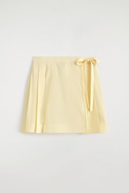 PLEATED MINI WRAP SKIRT — BUTTER YELLOW 7