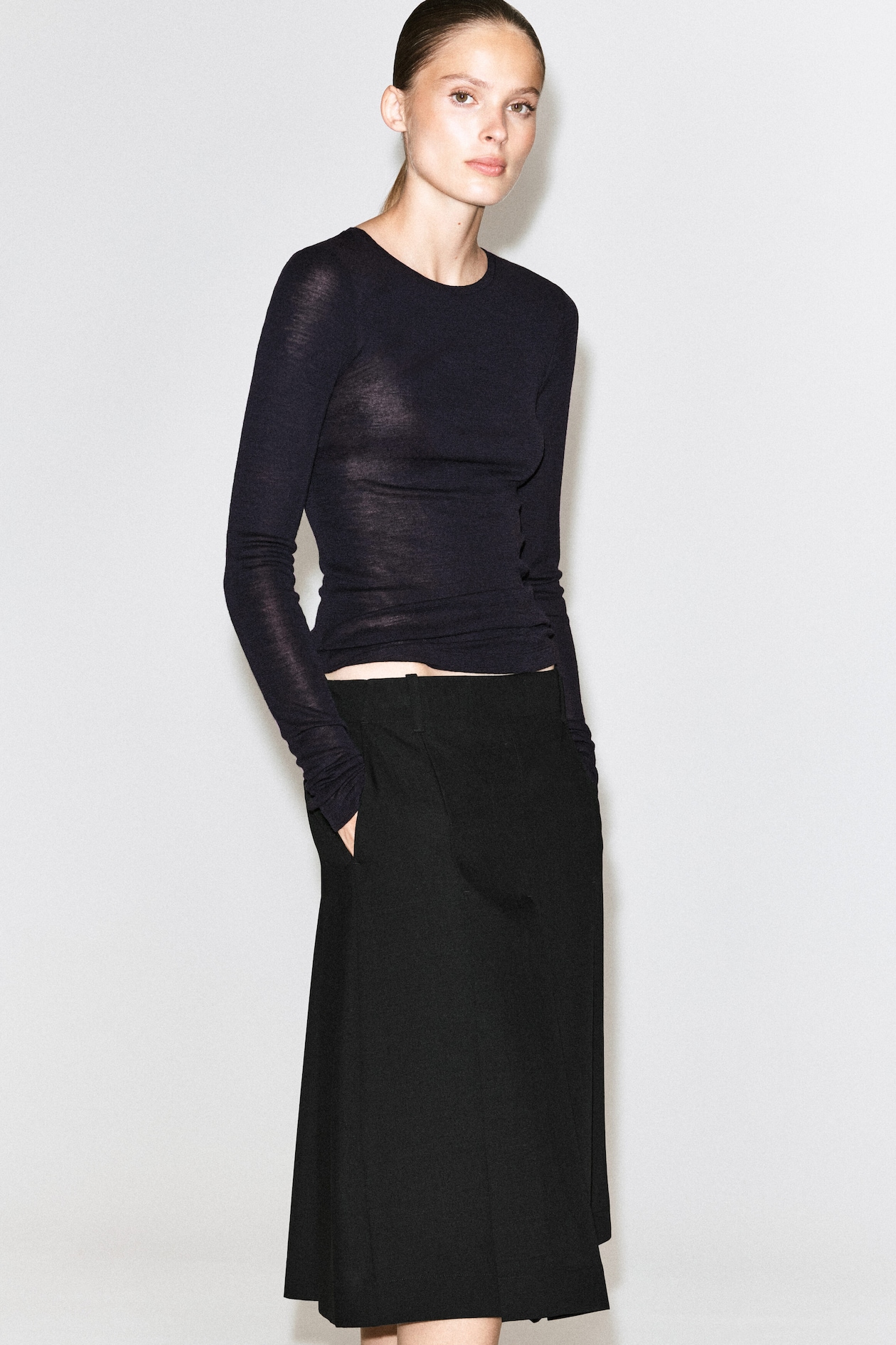 BOX-PLEAT WOOL MIDI SKIRT — BLACK