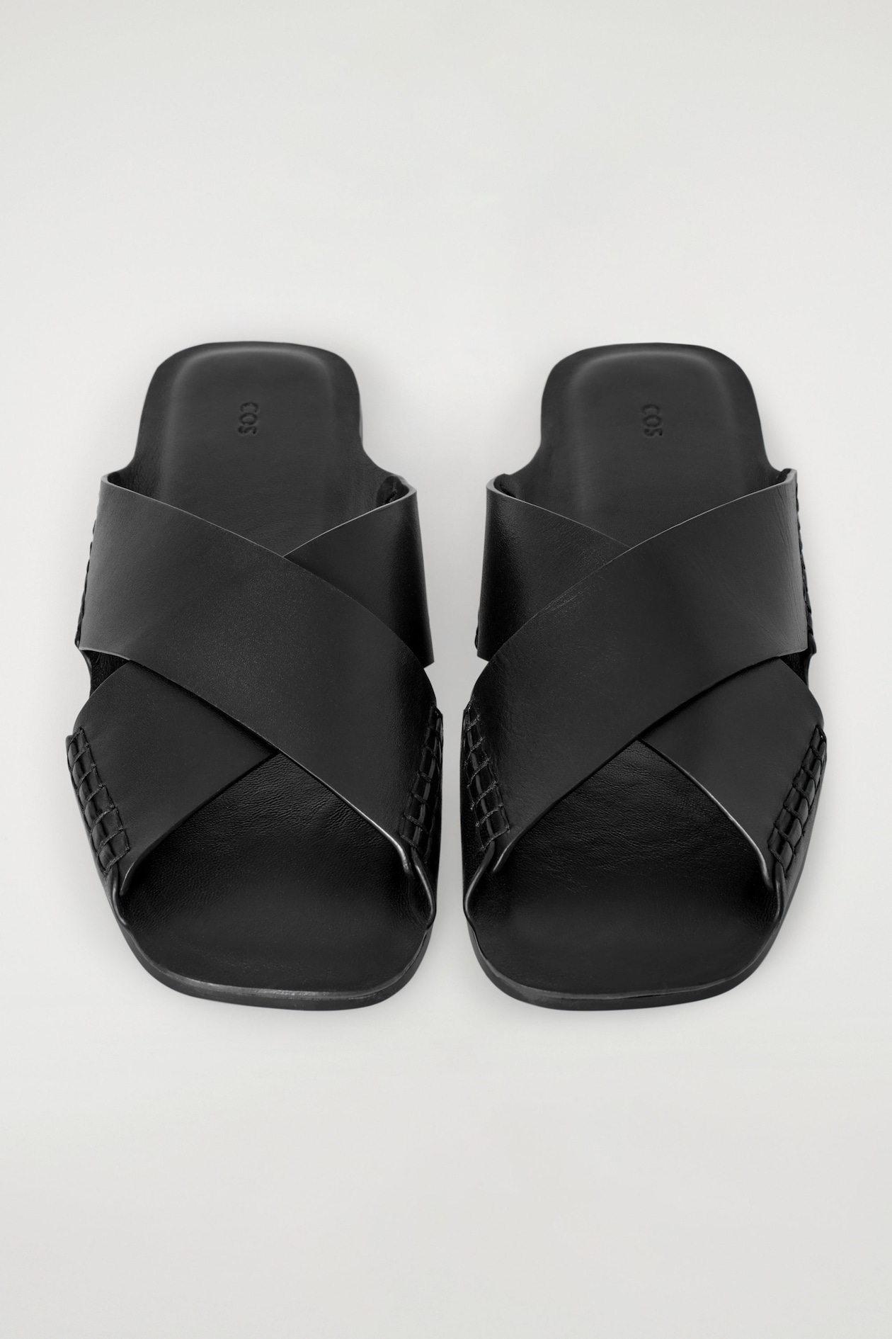 CROSSOVER LEATHER SANDALS — BLACK