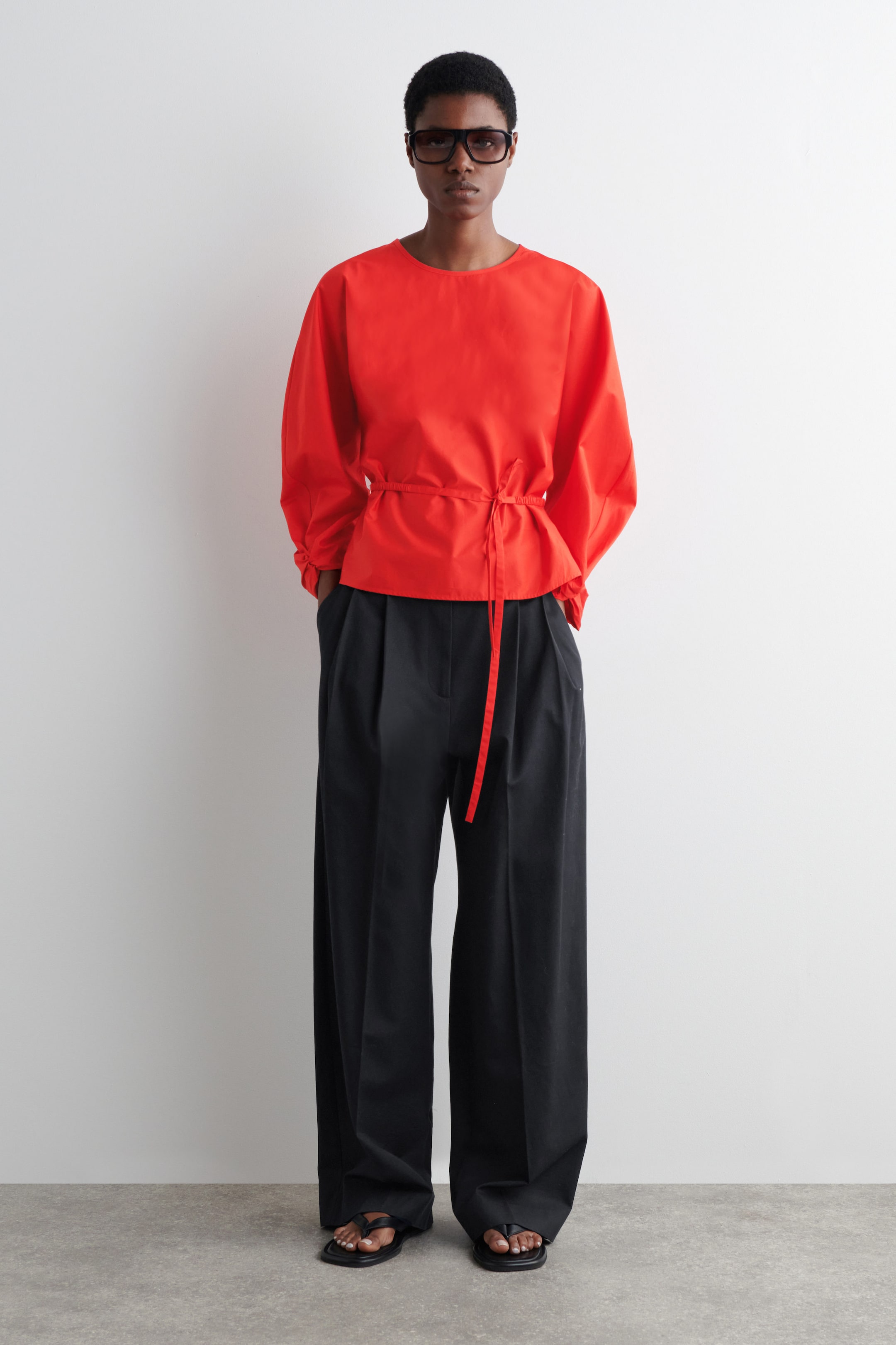 BLOUSE PÉPLUM À CORDON DE SERRAGE
