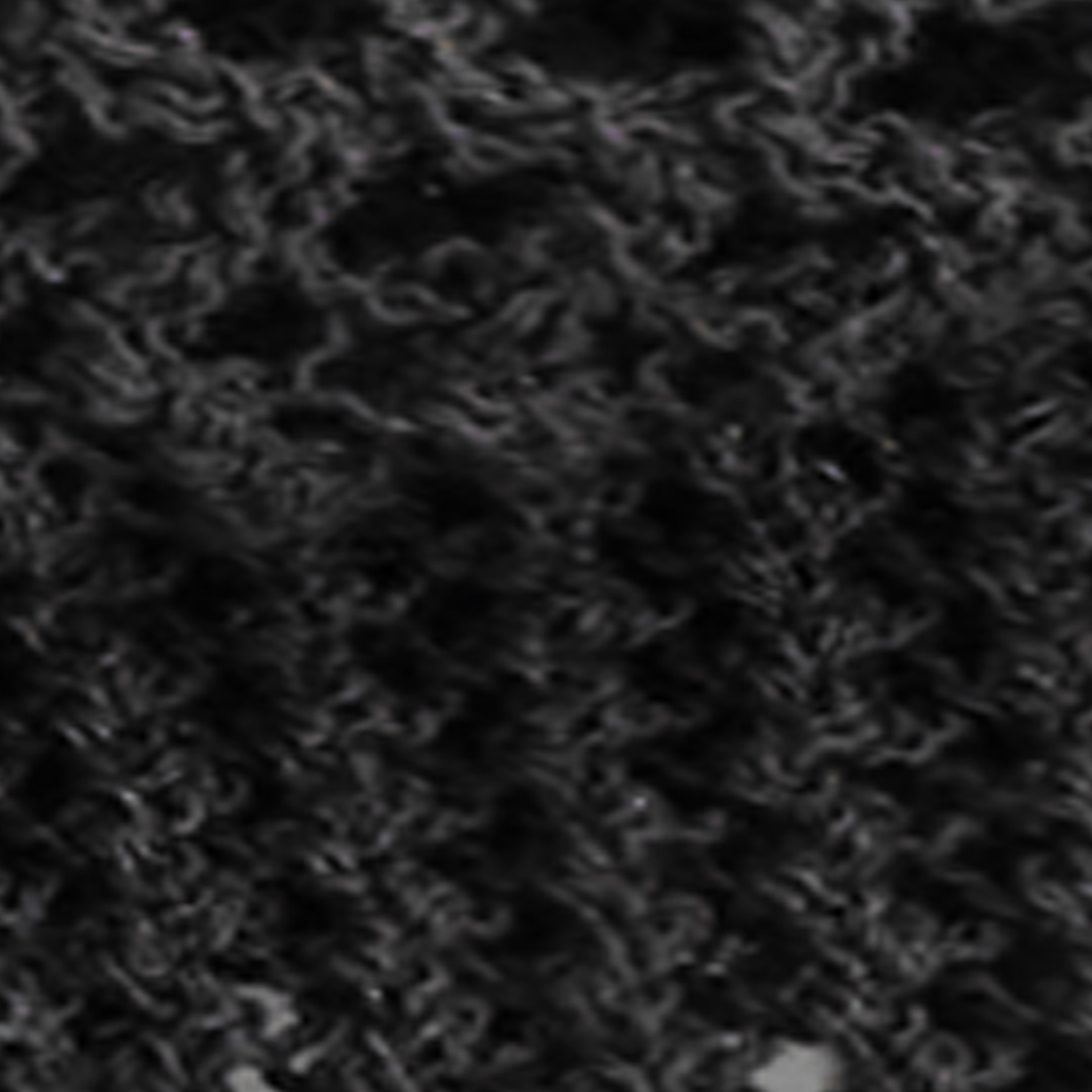 View larger image: The dark knitted fabric is displaying an intricate pointelle stitch, creating a refined openwork pattern.