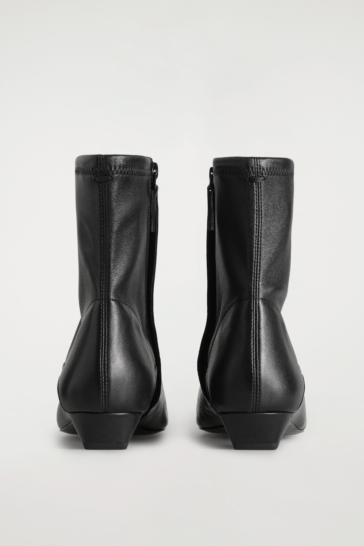 PANELED POINTED LEATHER WEDGE ANKLE BOOTS — BLACK
