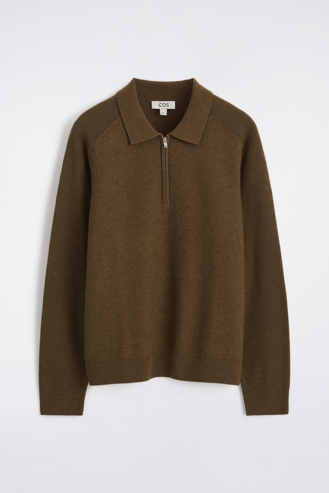 A paneled boiled-wool zip-up jumper in olive brown is shown from the front, featuring a classic polo collar with a silver-tone half-zip. The garment showcases a textured boiled-wool body contrasted with rib-knit detailing along the shoulders, long sleeves, cuffs, and hem.