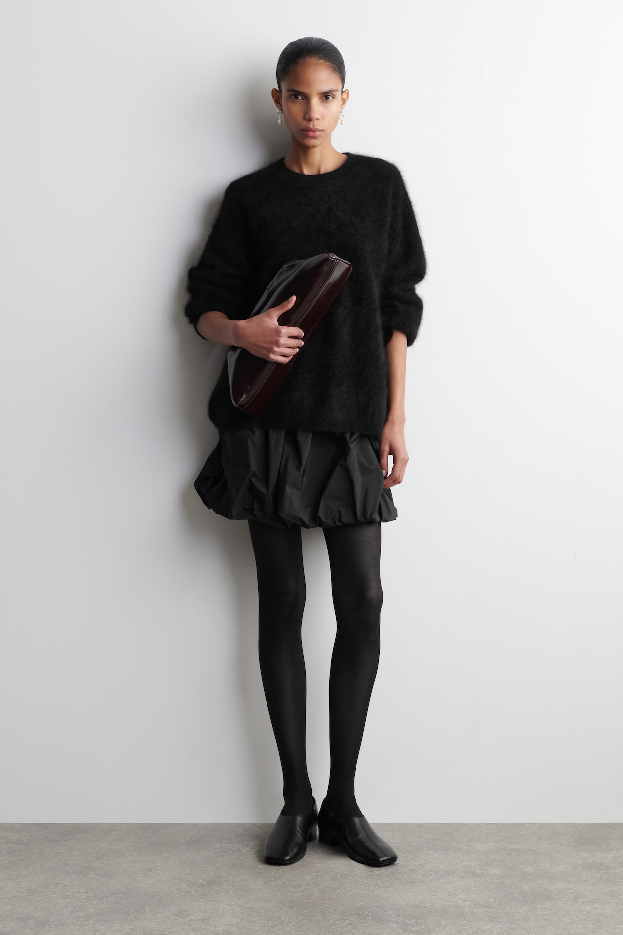 BUBBLE-HEM MINI SKIRT — BLACK