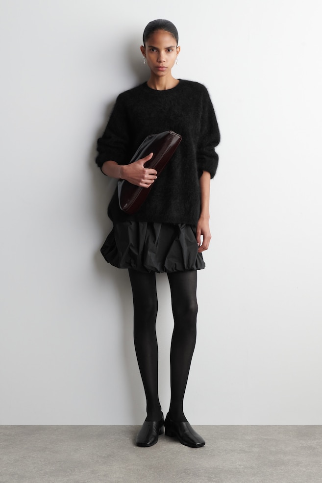 BUBBLE-HEM MINI SKIRT — BLACK