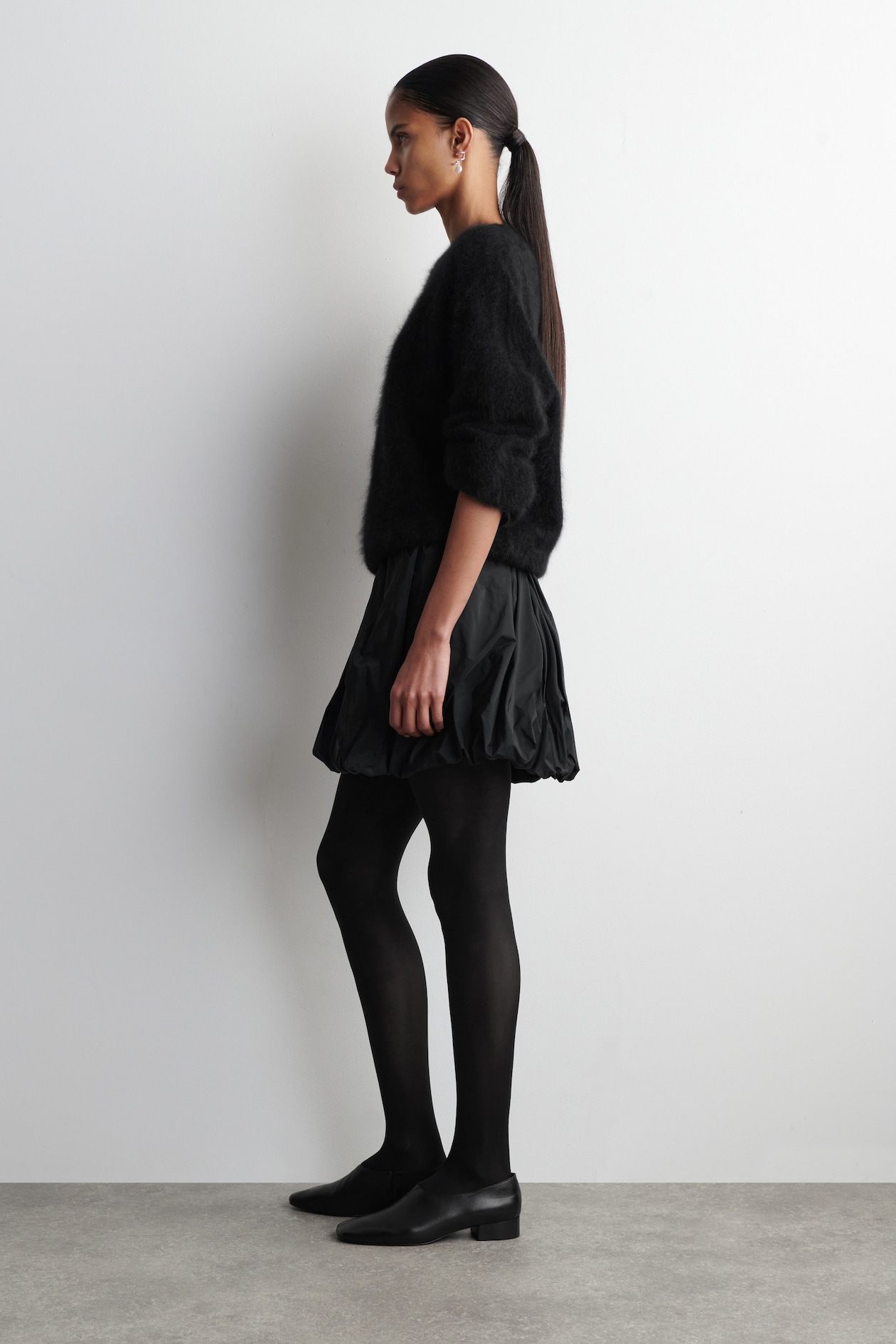 BUBBLE-HEM MINI SKIRT — BLACK