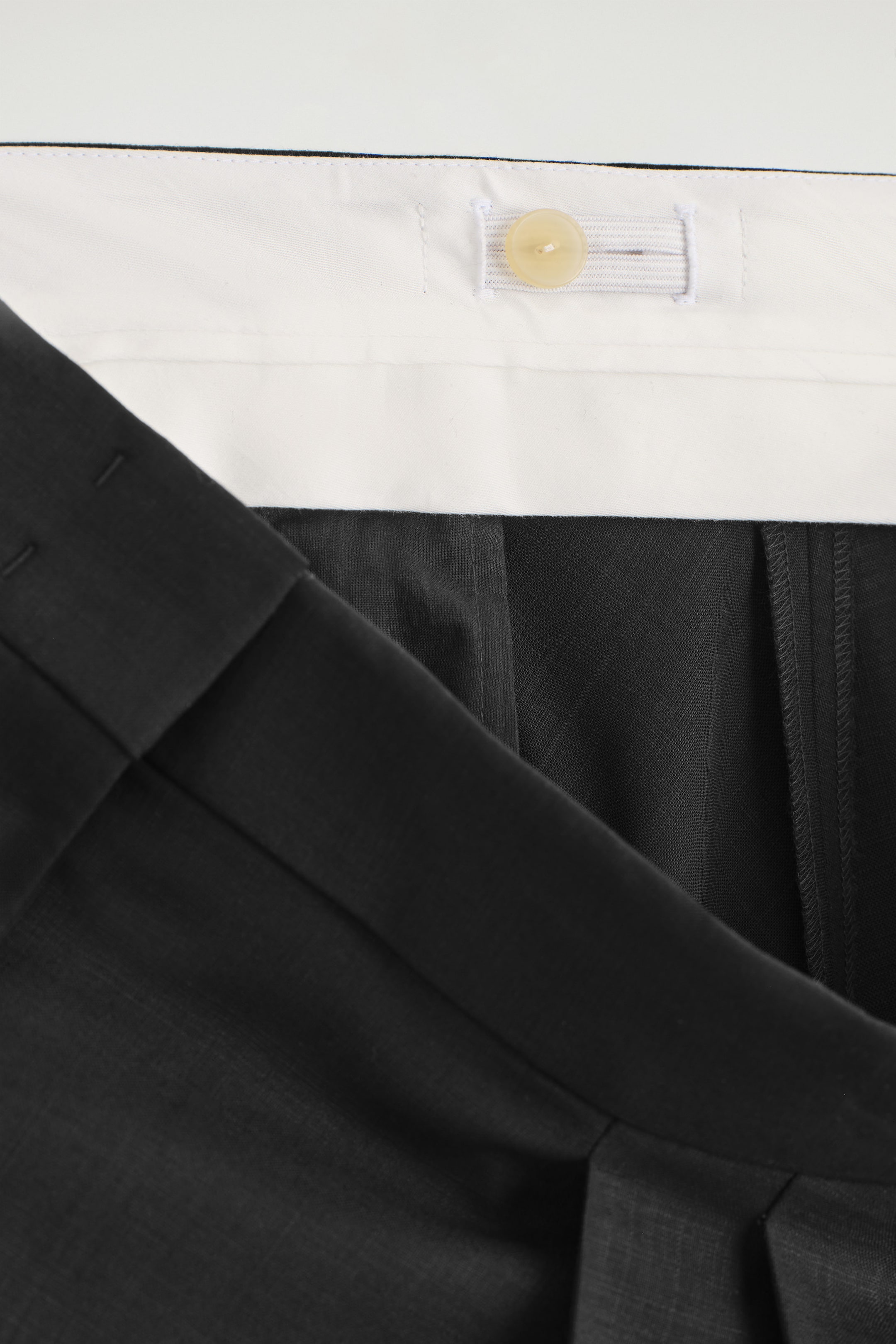 VOLUMINOUS WOOL TROUSERS