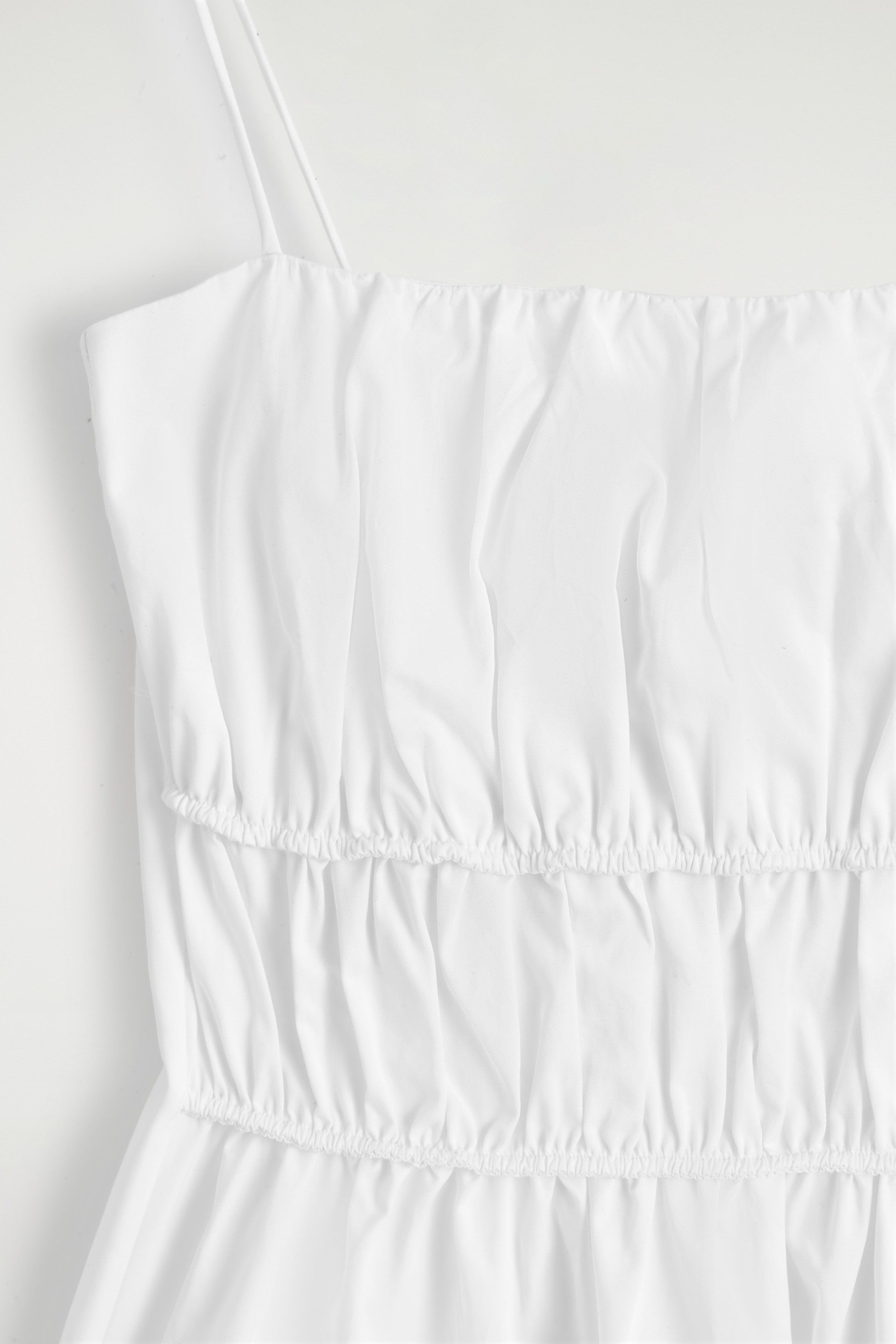 Grösseres Bild ansehen: OBERTEIL AUS BAUMWOLLE MIT SCHÖSSCHEN - WEISS - DAMEN | H&M CH 7