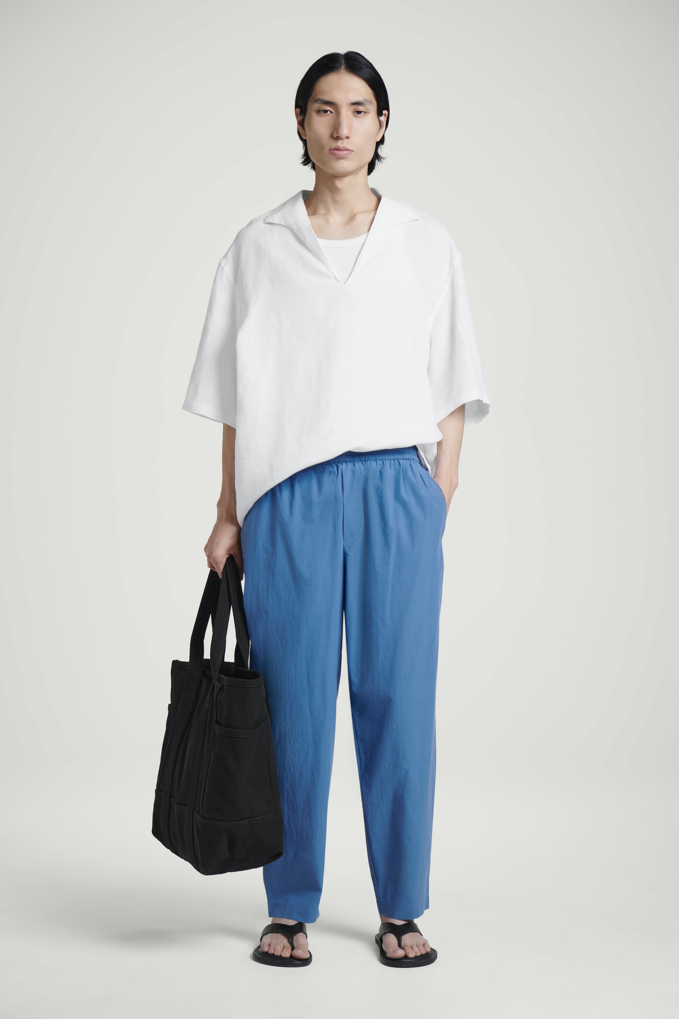 Visualizza immagine più grande: PANTALONI AFFUSOLATI ELASTICIZZATI IN COTONE - BLU - UOMO | H&M IT 1