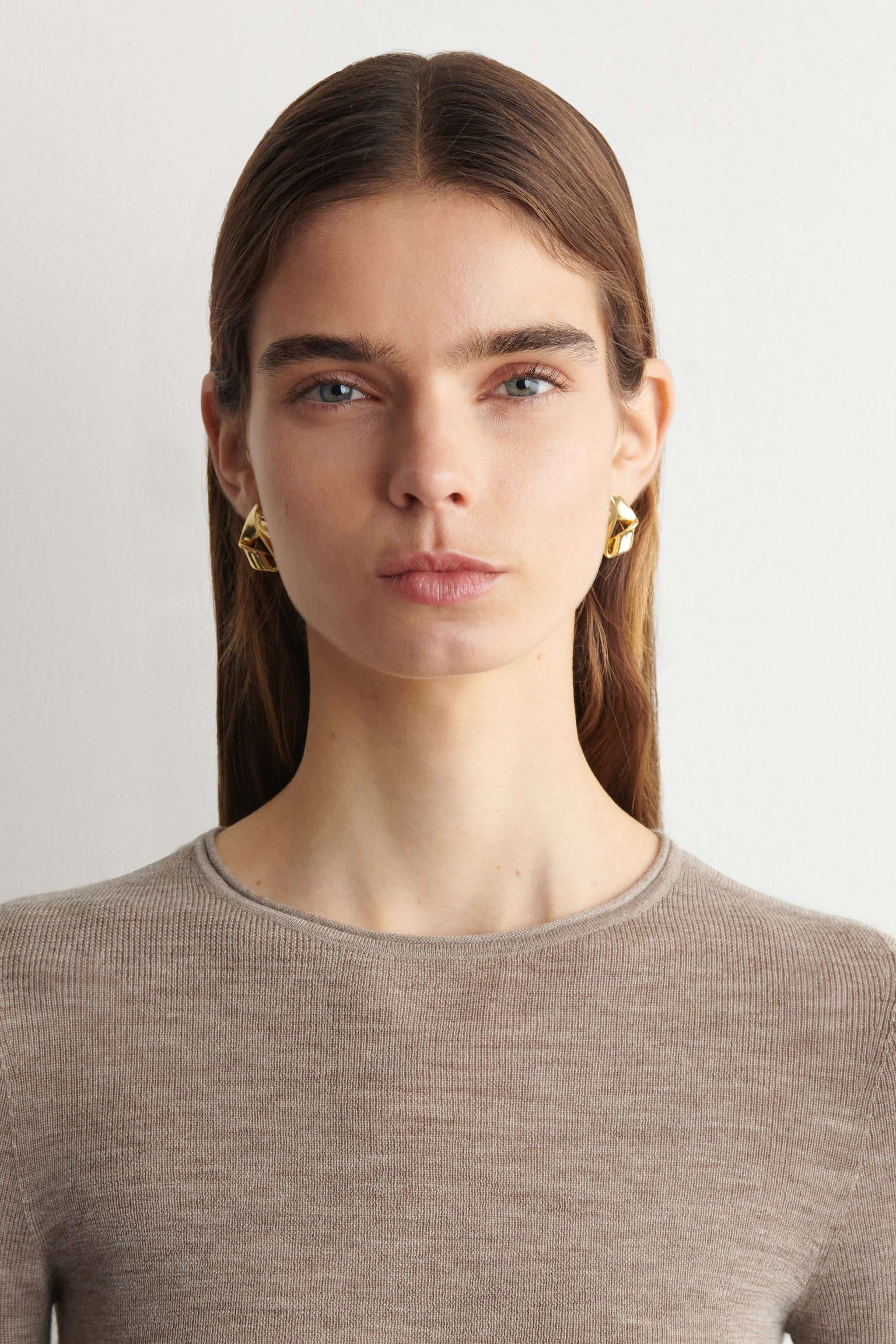 COS Twisted Ribbon Stud Earrings a sculptural accessory for