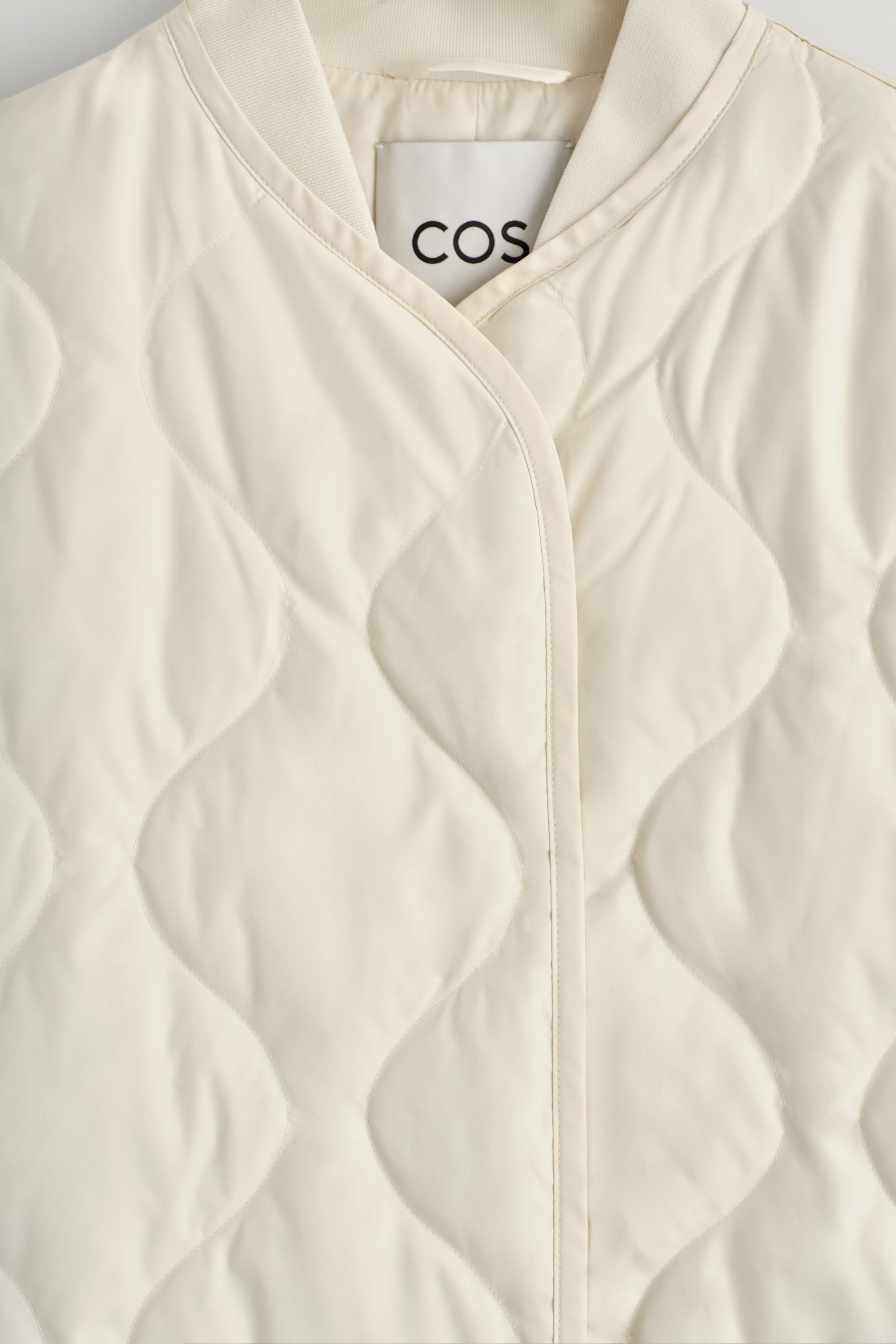 OVERSIZED QUILTED JACKET - IVORY | COS